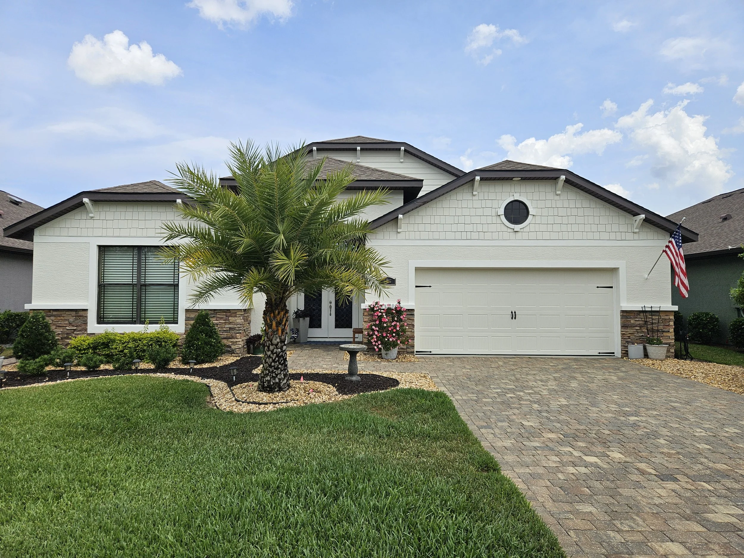 Home in Ormond Beach after we primed and painted exterior with Sherman Williams emerald rain refresh.