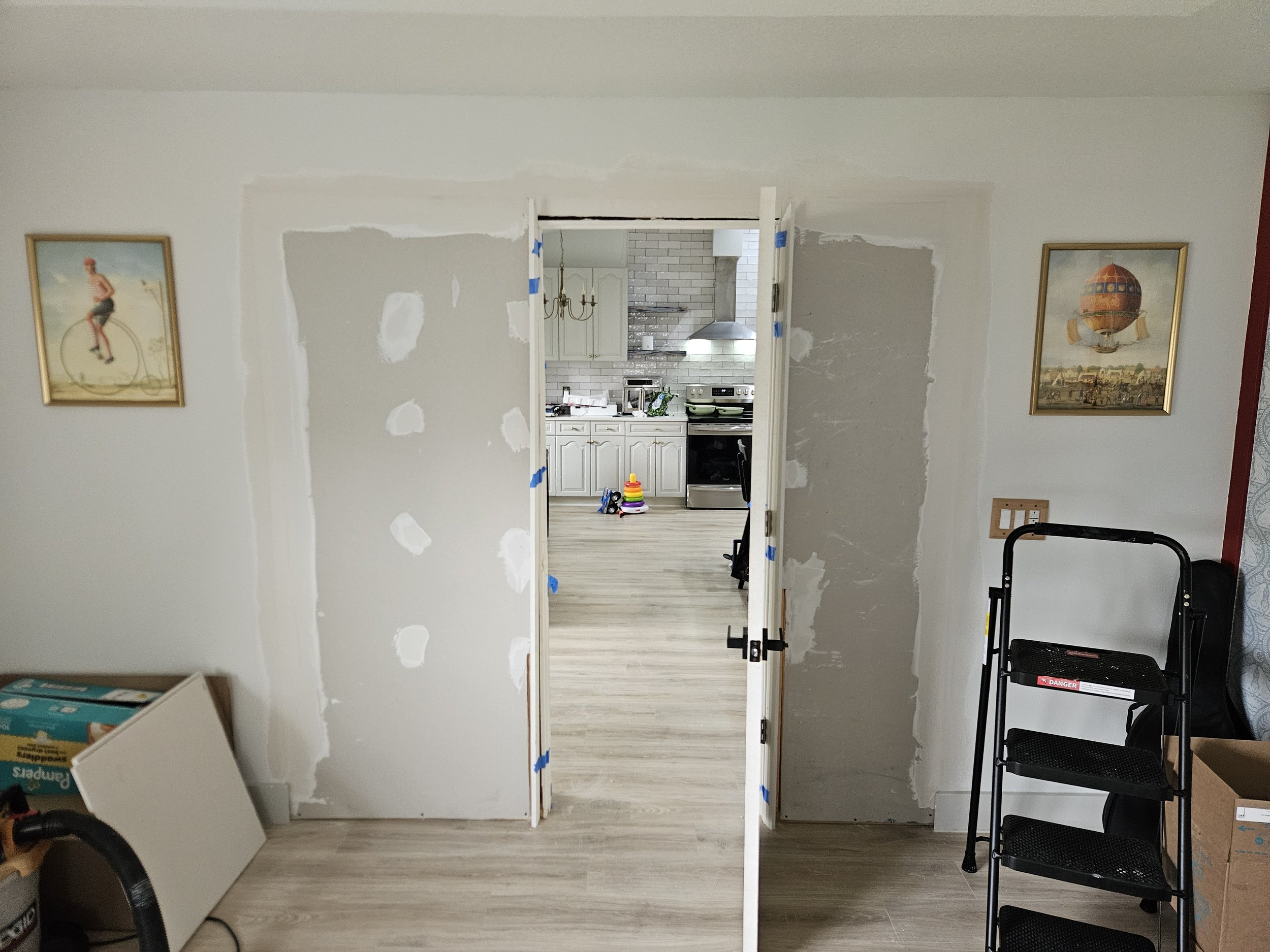 Dry wall installed and 1st coat of mud applied on interior project to wall off opening for new office.