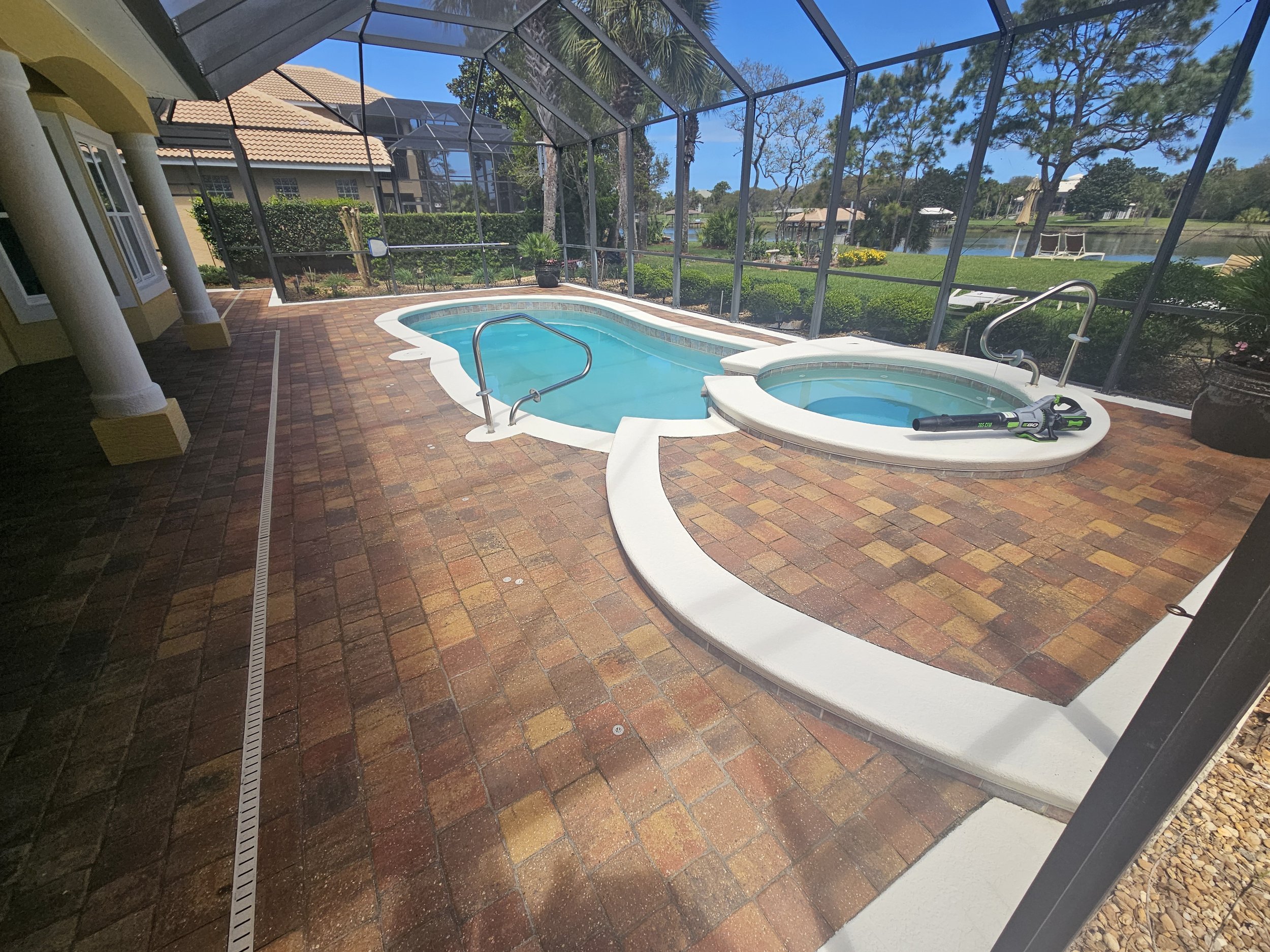 Palm Coast home after we painted their pool and lanai trim and sealed the pavers with latex sealant.