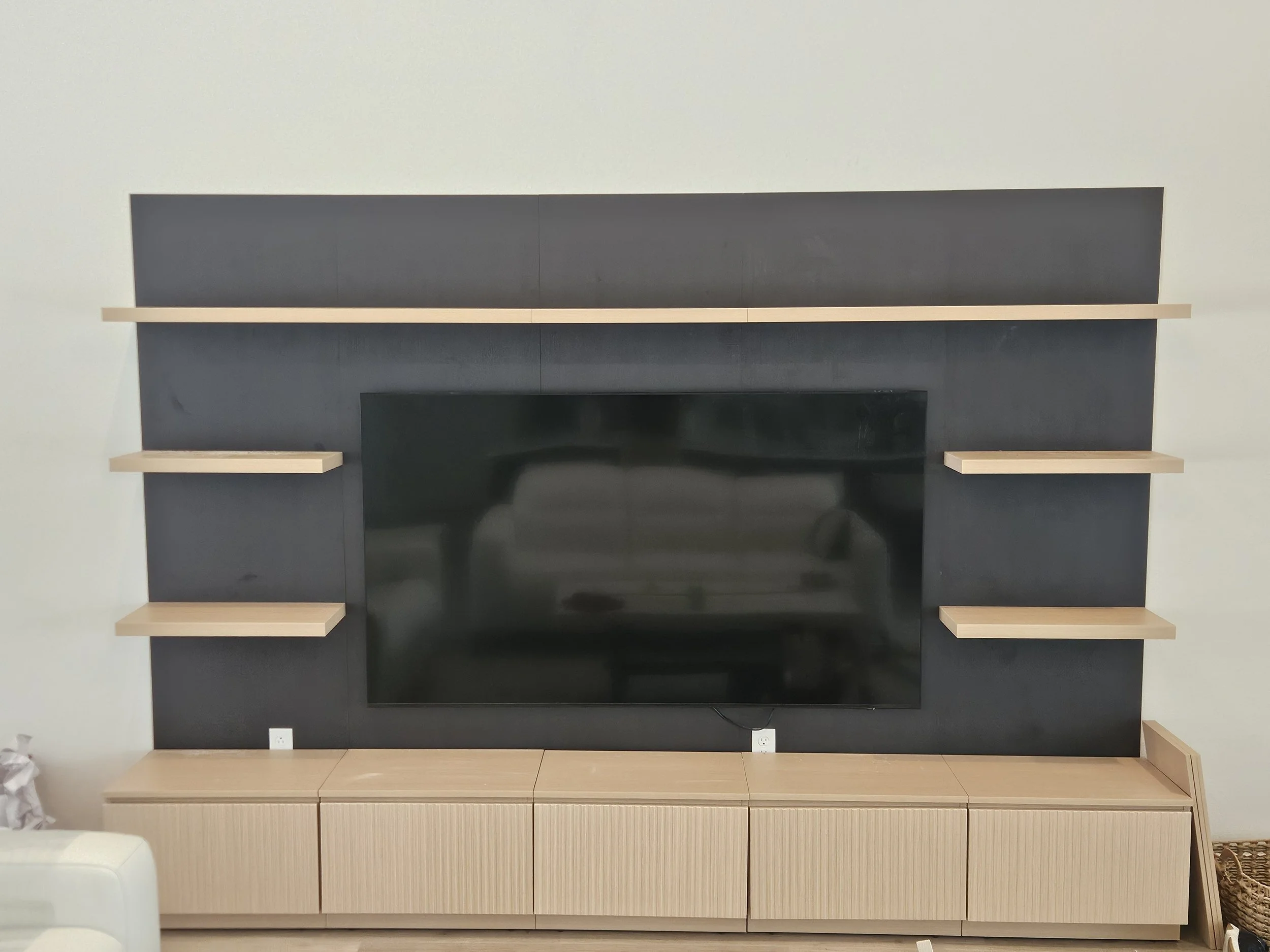 A modern black and wood entertainment center we installed in Palm Coast, Florida.