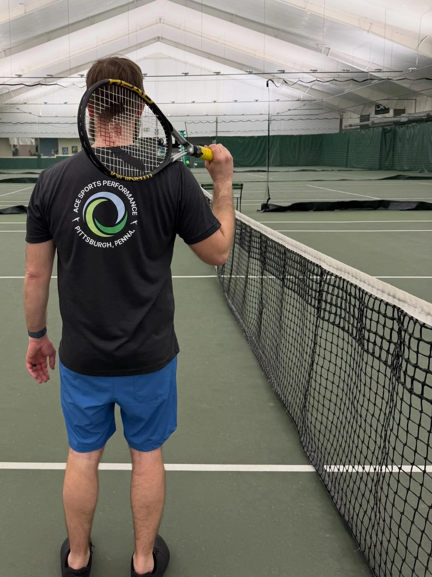 Showing off one of the new Ace shirts at our tennis practice tonight.  I felt great tonight, moved fast and hit well..has to be the shirt.  Come see for yourself!