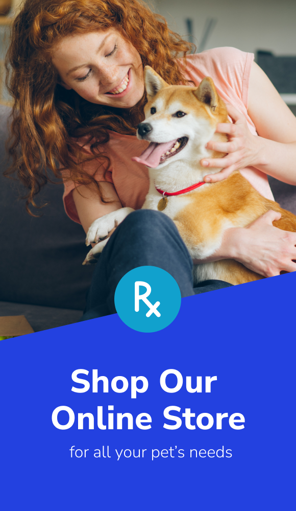 A banner with the picture of a young woman petting her shiba inu with text that reads: Shop Our Online Store for all your pet's needs. The link leads to the online pharmacy.