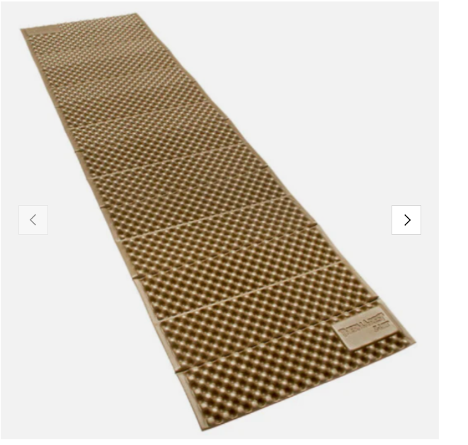 A brown reflective woven metallic walkway or mat with a textured surface and a small label at one end.