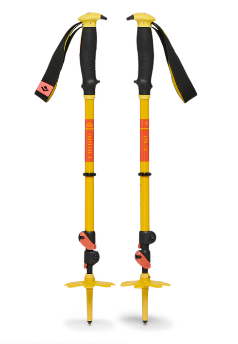 Pair of yellow trekking poles with black handles, red accents, and adjustable straps.