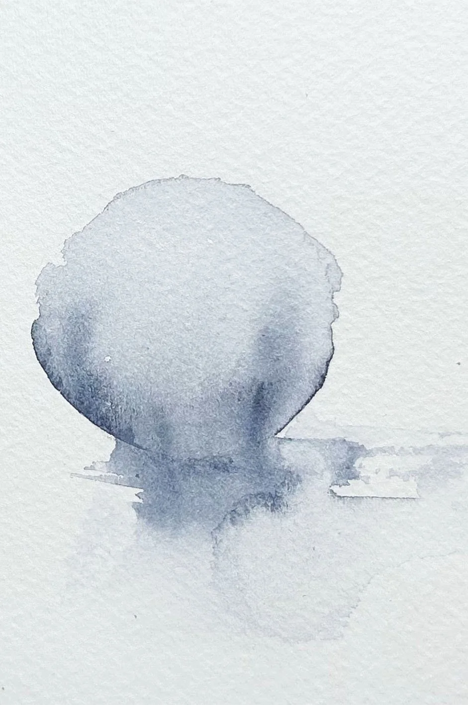A watercolor painting of a round object with a small face on a white textured background.