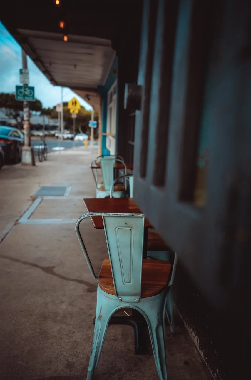 Still image of cafe chairs in front of coffee shop