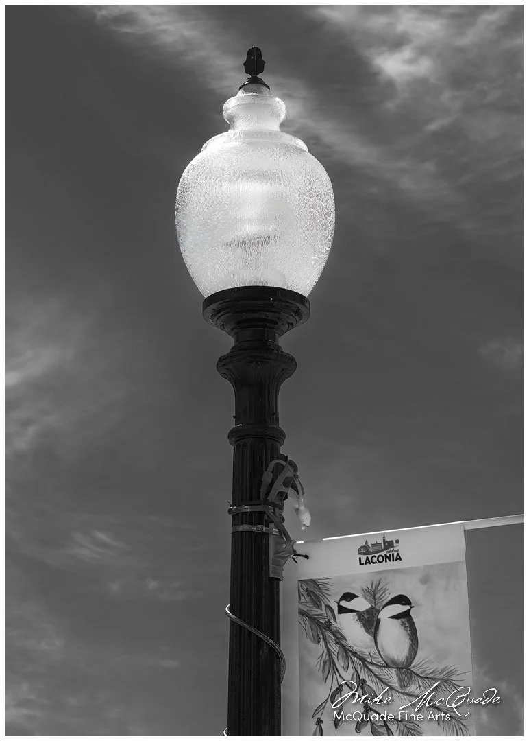 Period Lamp Posts brighten the streets of Laconia to this day.