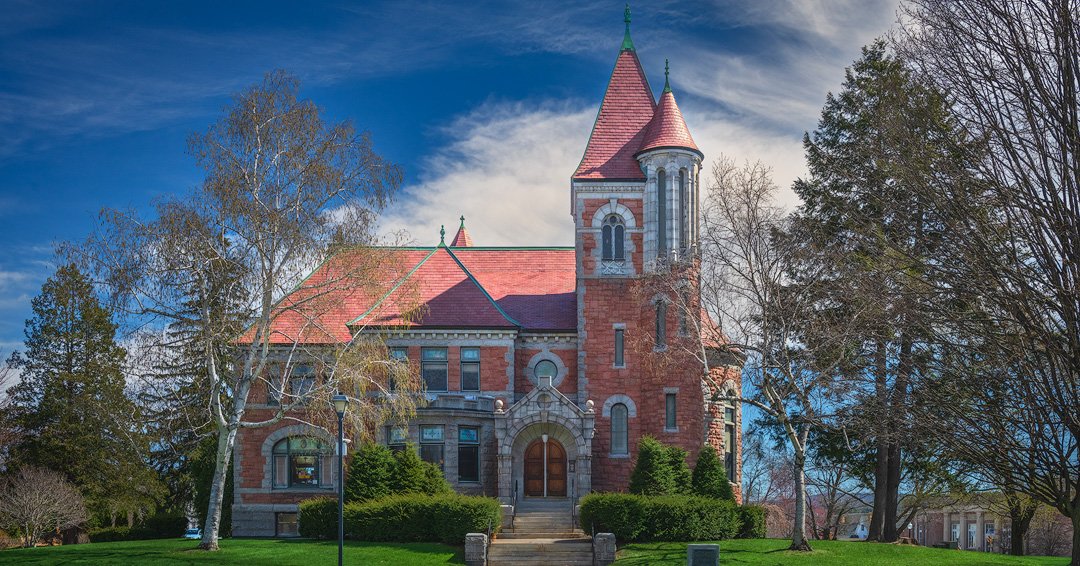 Laconia Public Library in mid-morning sun on an early spring day.