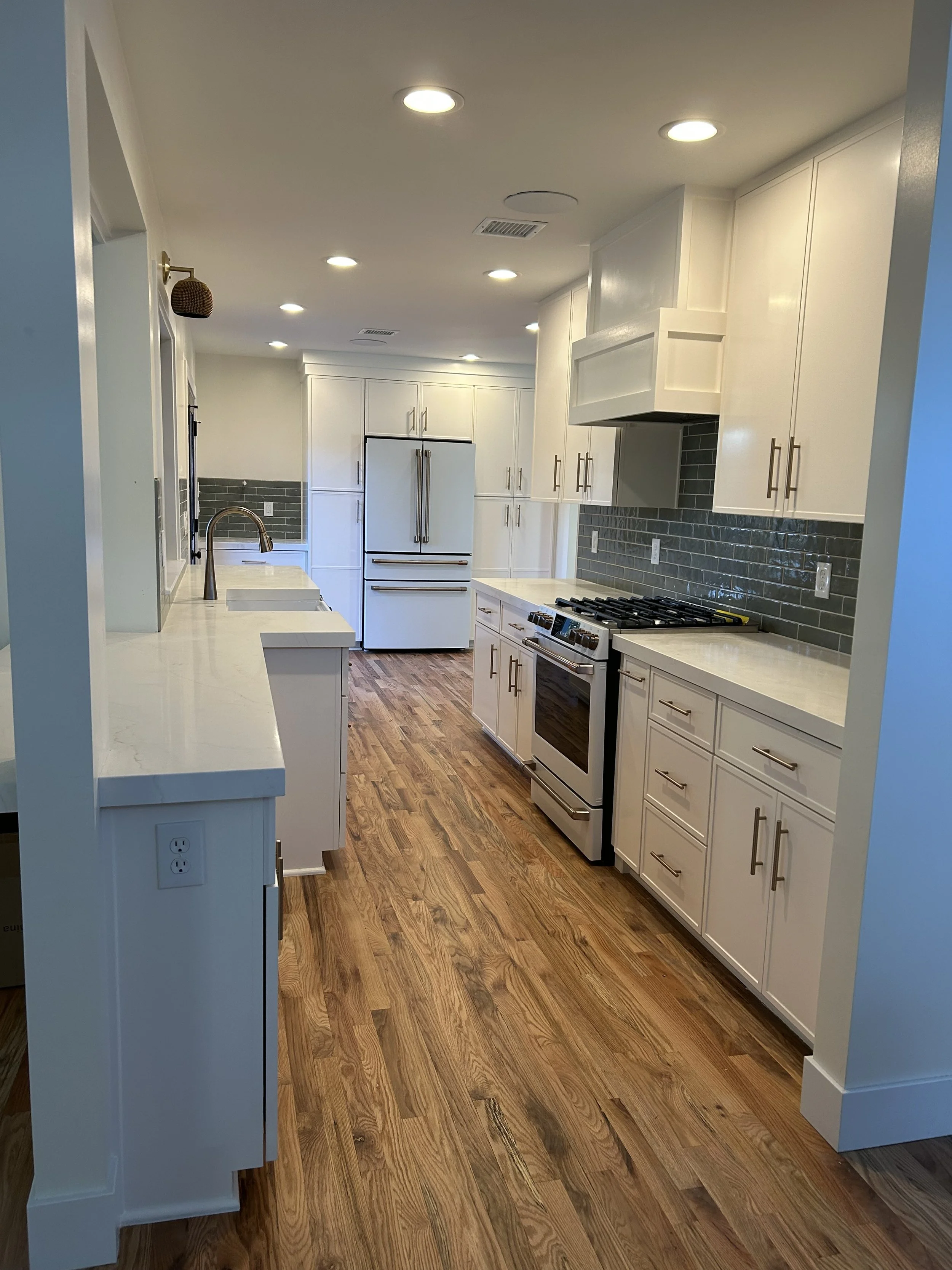 Custom kitchen with hardwood cabinetry by Freedom Woodwork