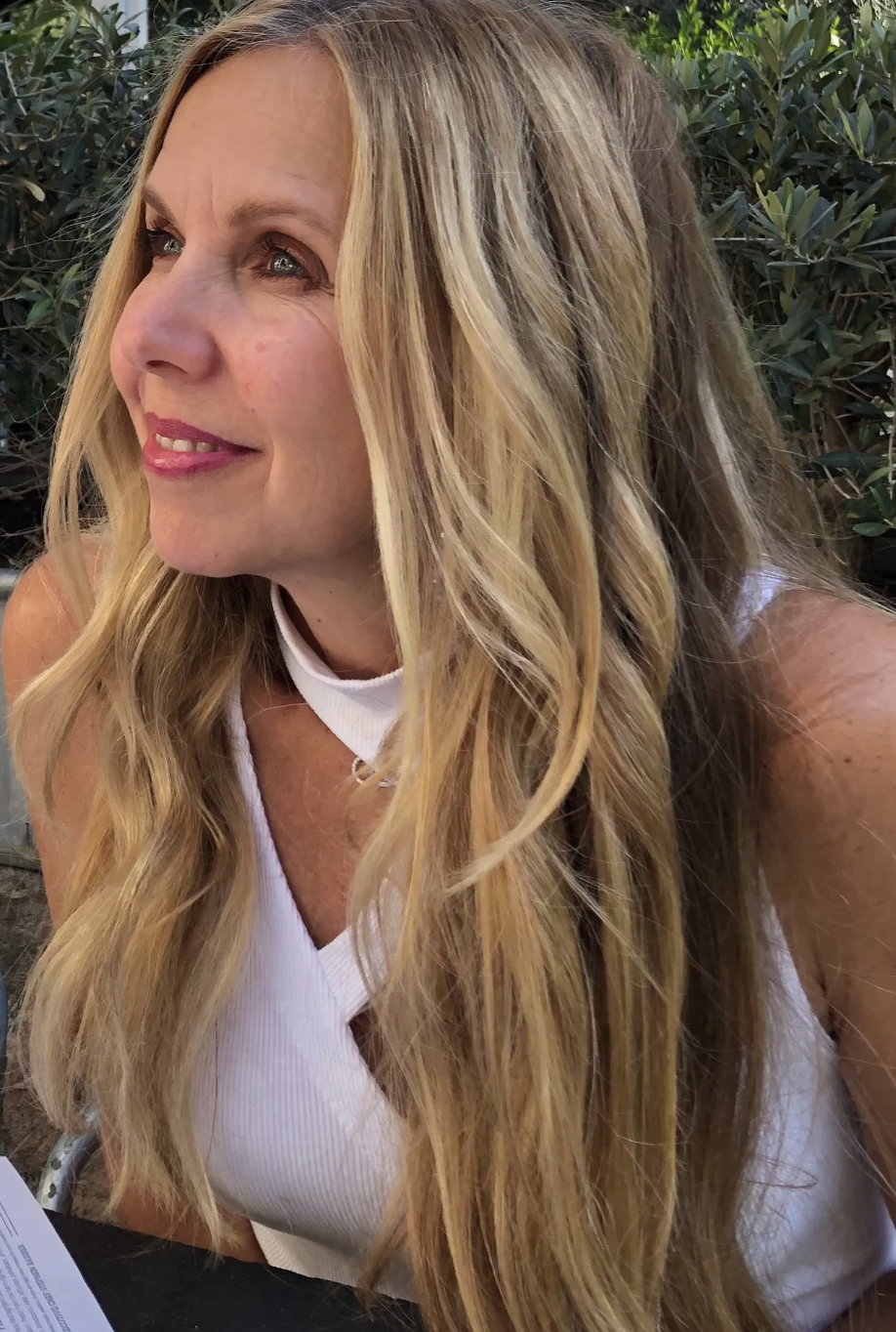 Kirsten Nelson Telan joyously looking off into the distance