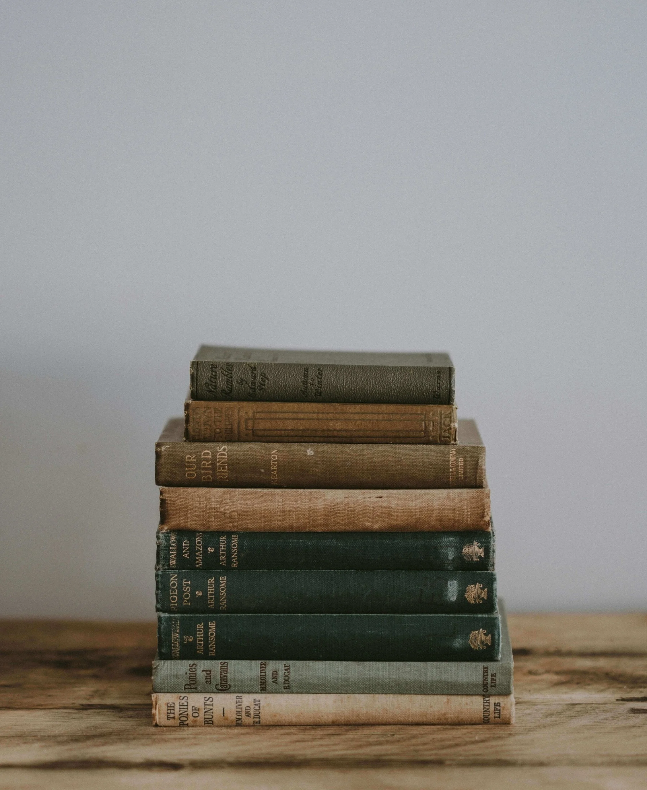An Author's Stack of NYTs Bestsellers
