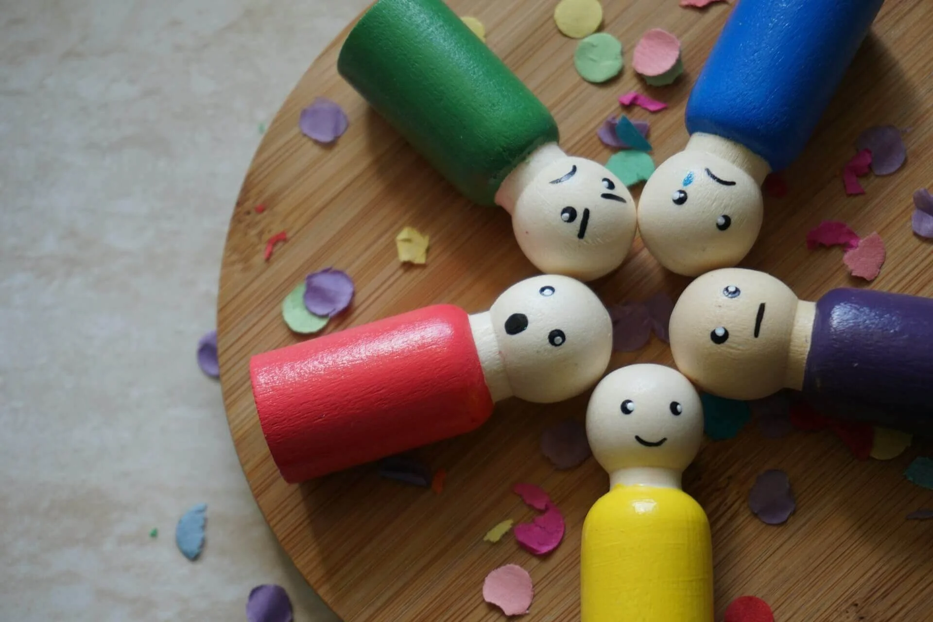 FIgurines showing basic human emotions such as happiness and anger