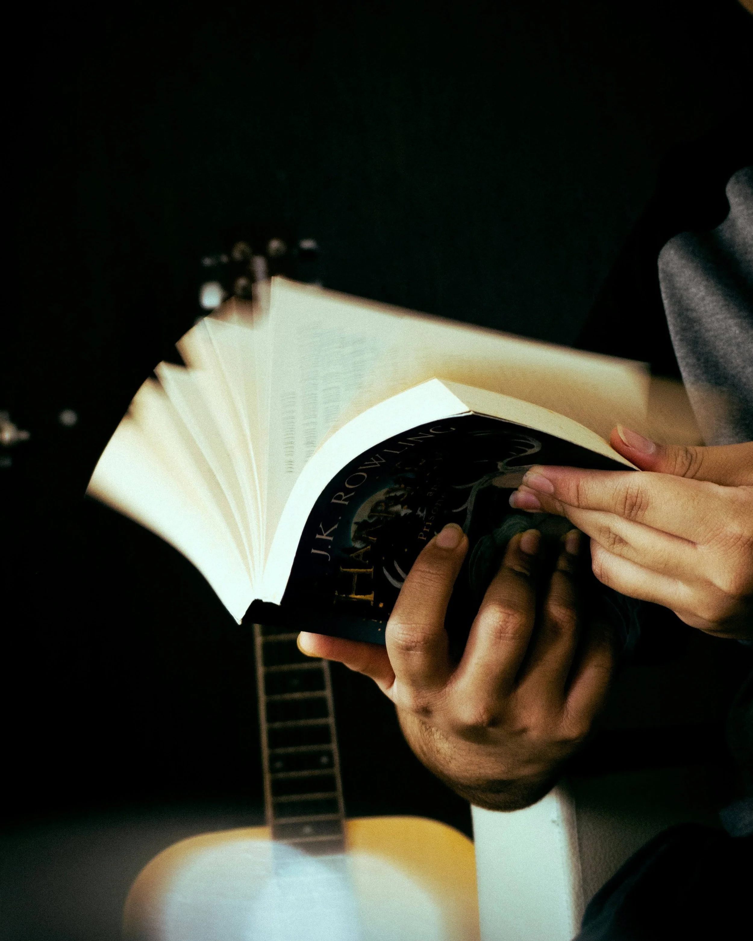 Musician reader flips through a fiction book