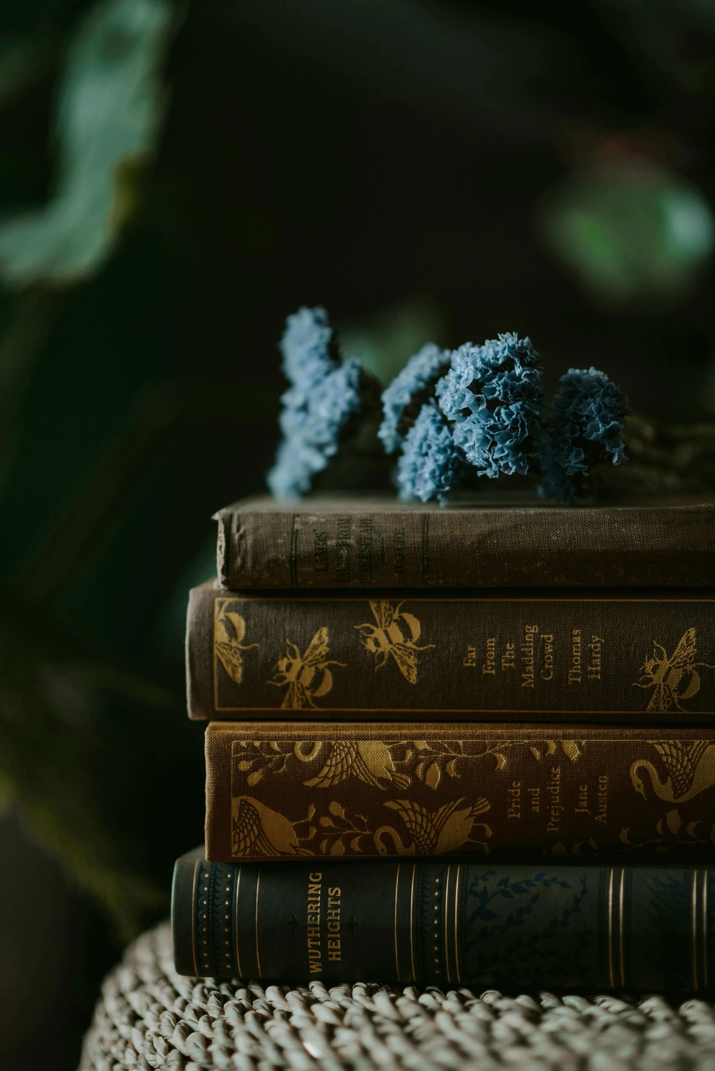 Stack of antique academia style books and flowers