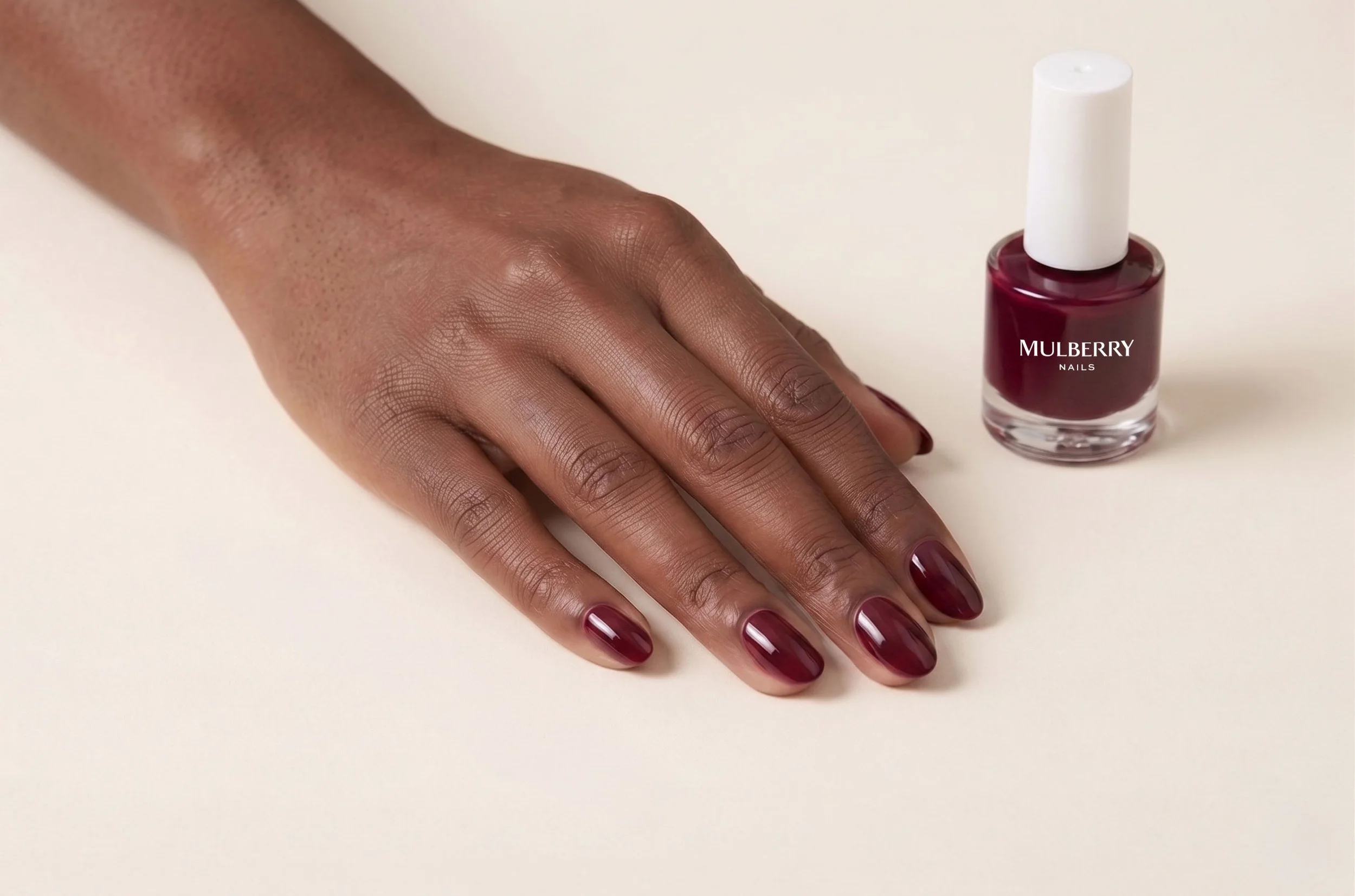 dark-burgundy-nails-with-bottle.jpg