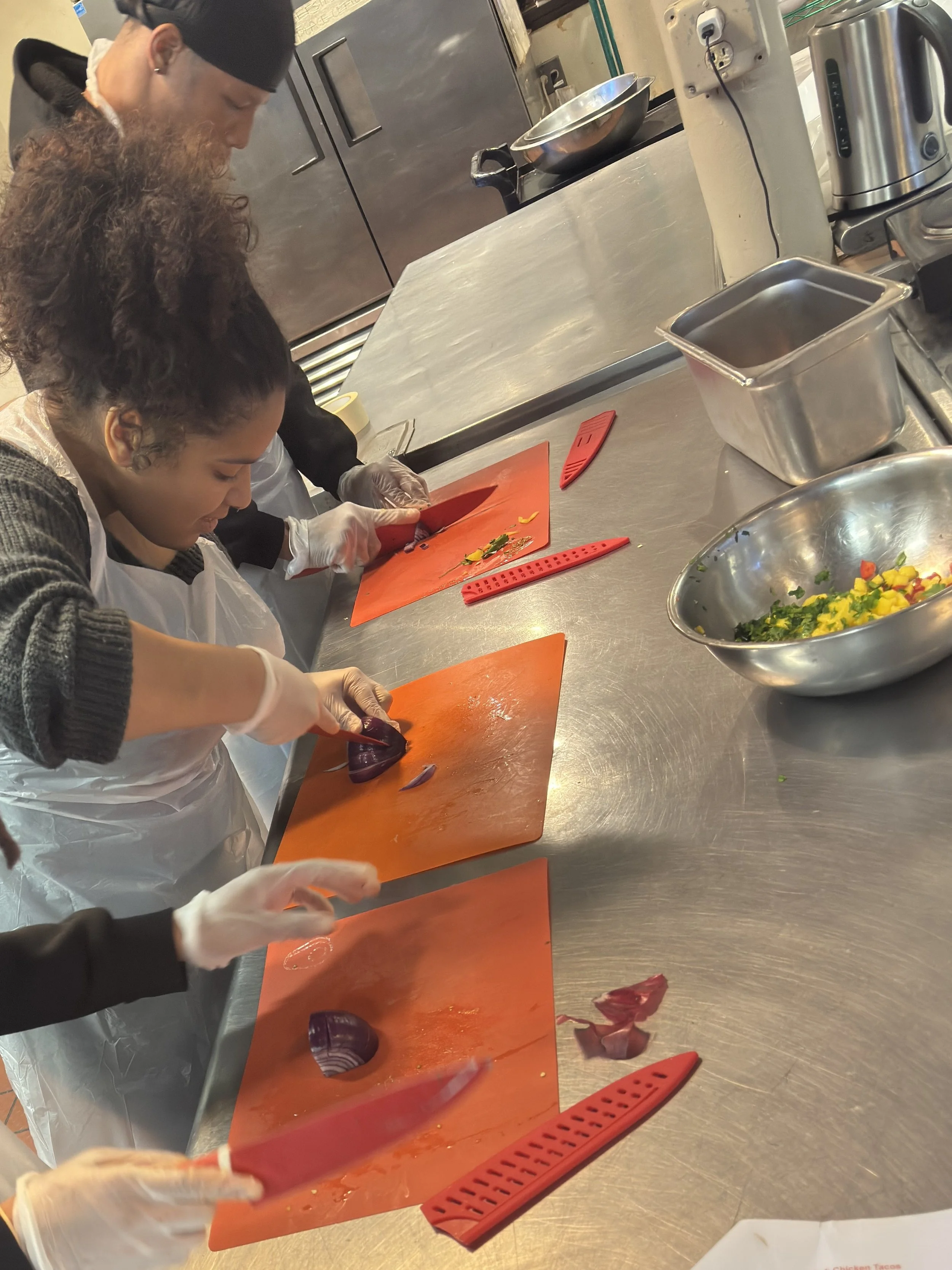 This Monday, students from our Building Trades Exploration cohort learned cooking skills with Haley House's Take Back the Kitchen program. This hands-on class teaches students foundational cooking techniques, kitchen safety, and nutritional eating.

