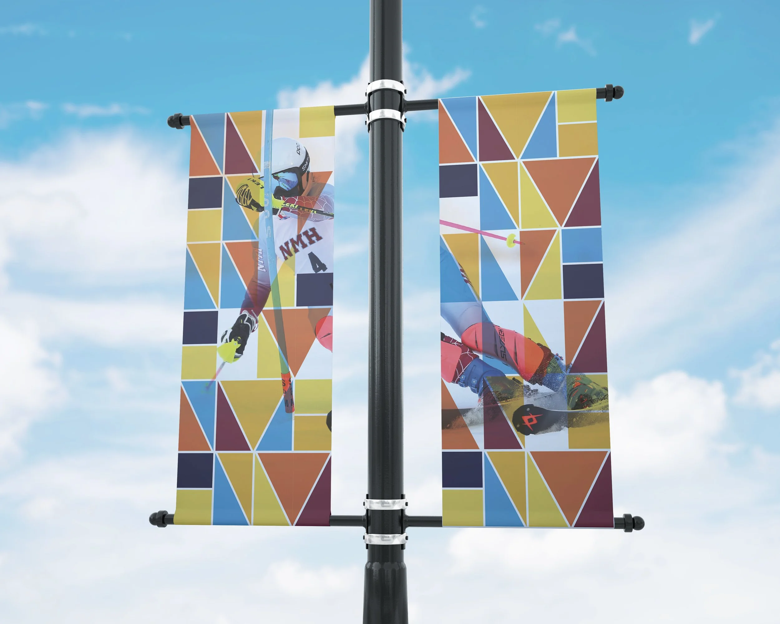 Northfield Mount Hermon campus banners featuring the colorful geometric visual identity.