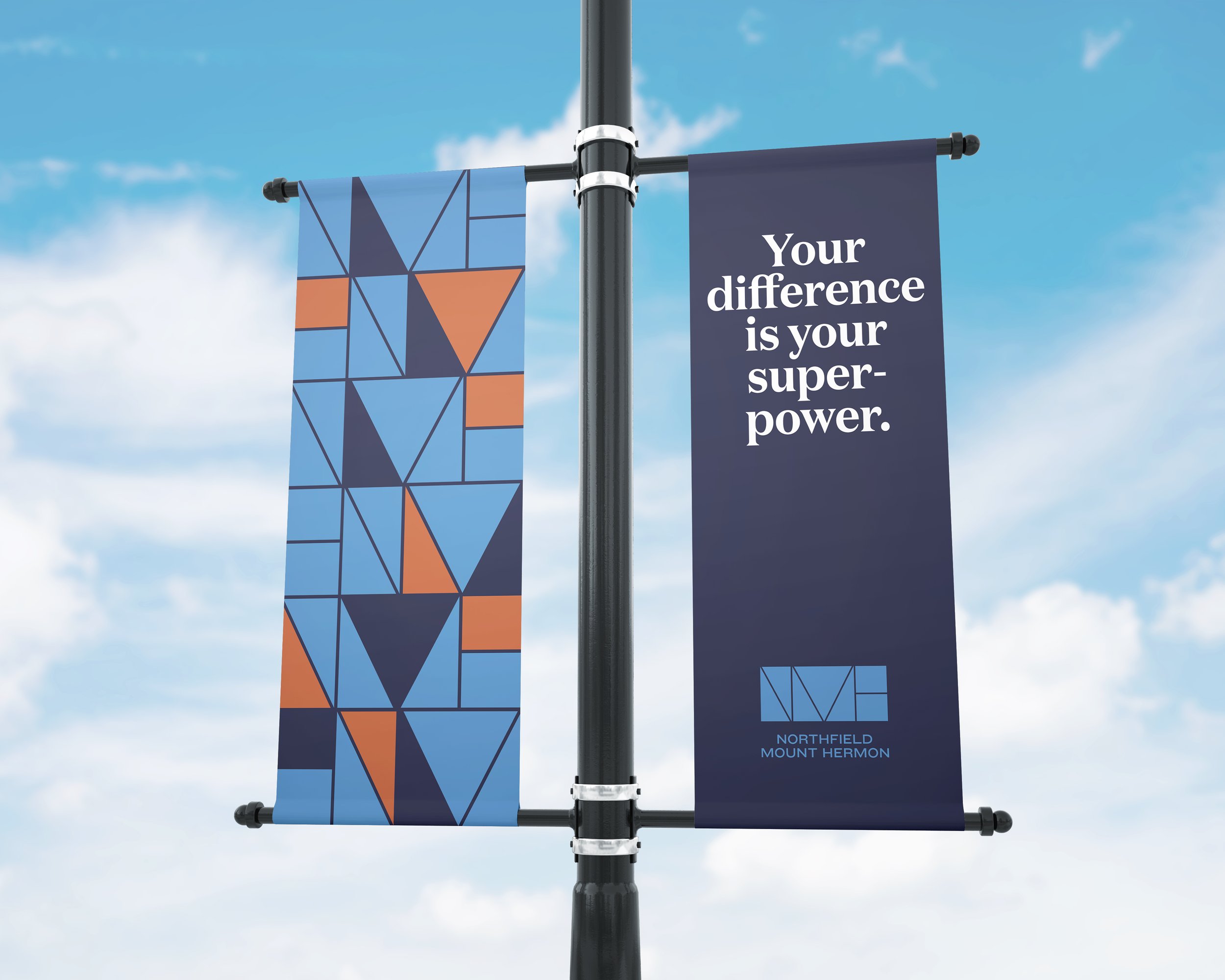 Northfield Mount Hermon campus banners featuring the colorful geometric visual identity.