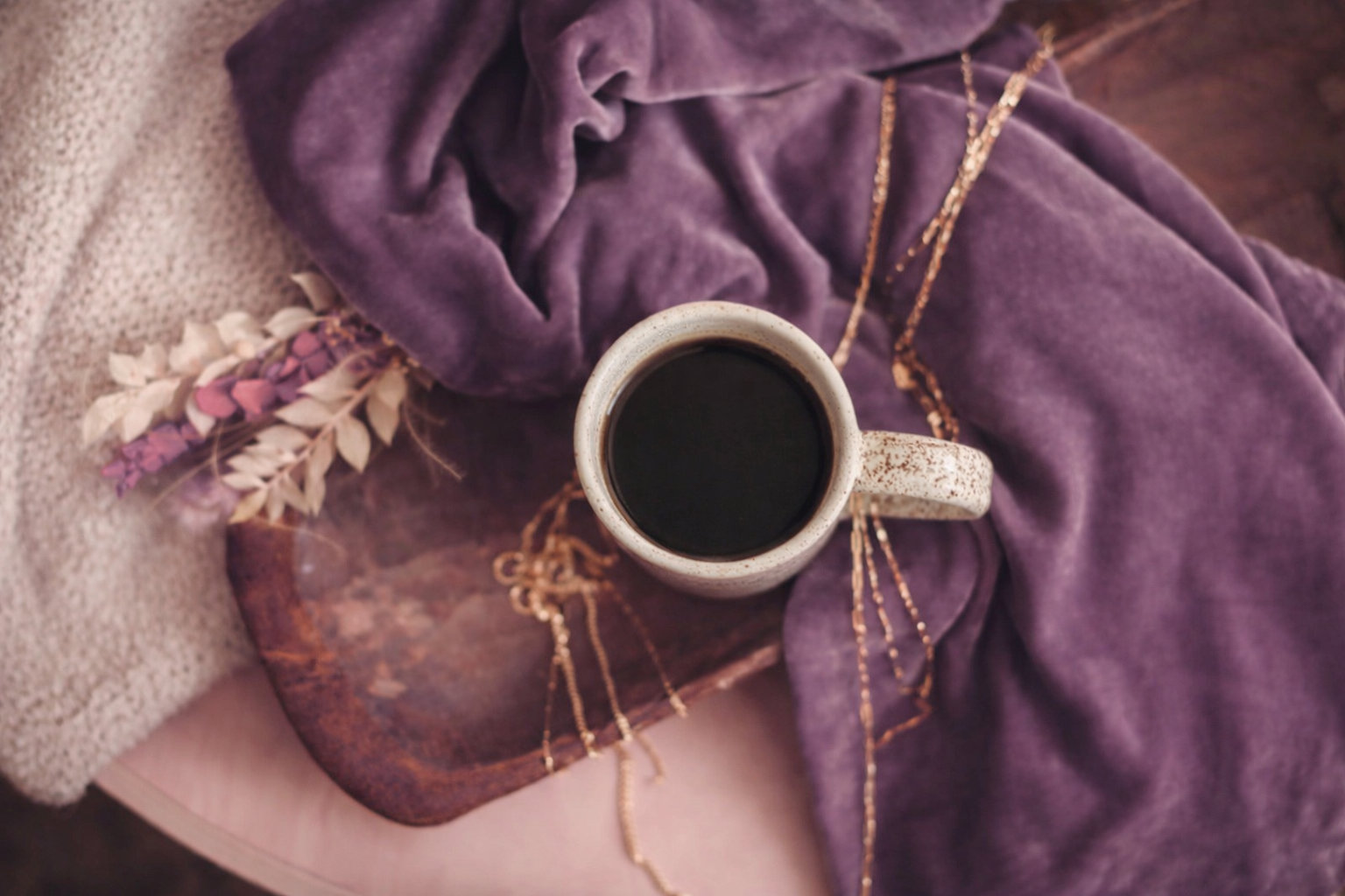 Morning ritual with tea and gold jewelry, symbolizing intentional living, personal growth, and meaningful rituals