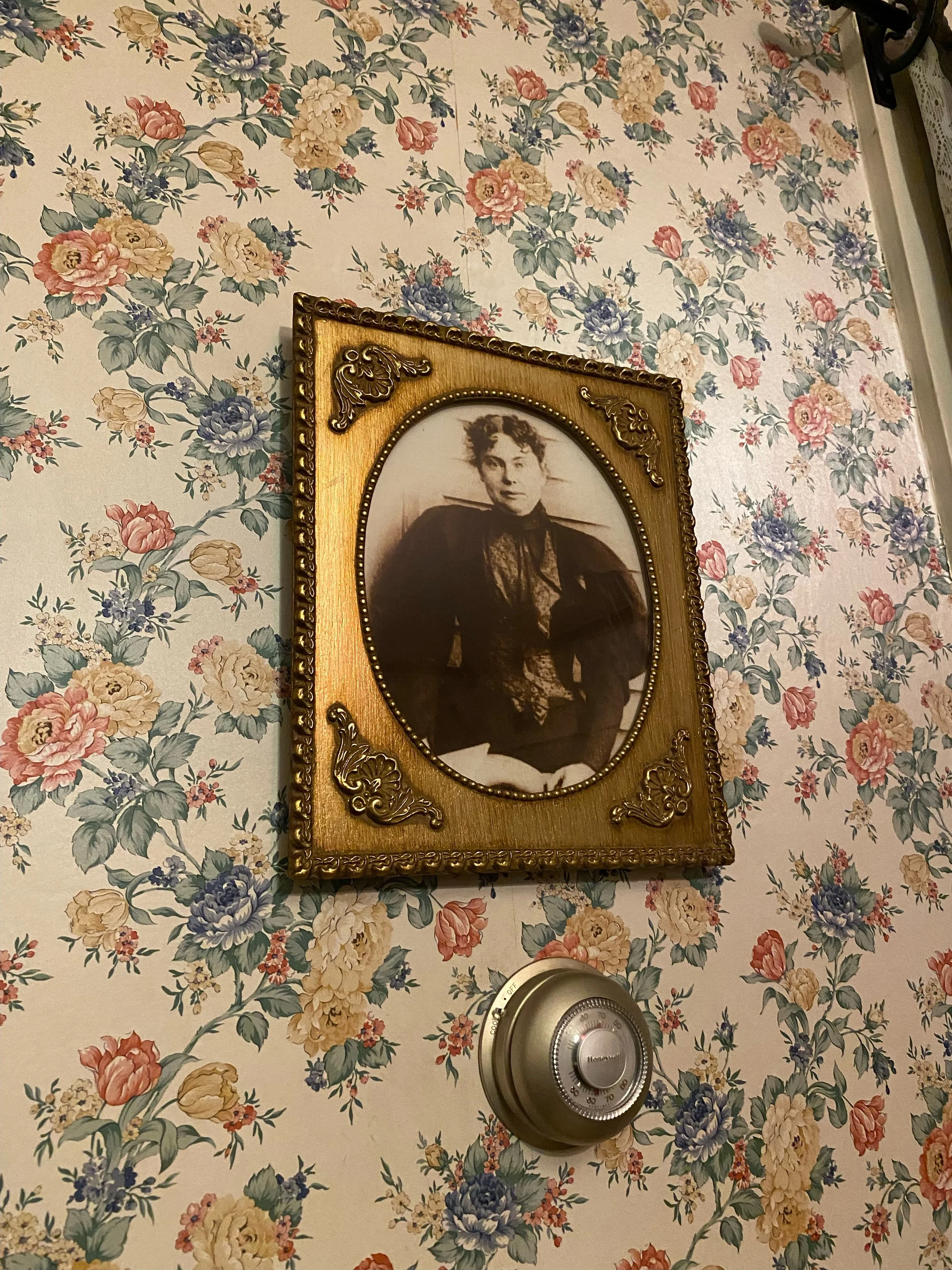Photo of Lizzie Borden in the parlor of the Lizzie Borden Bed & Breakfast