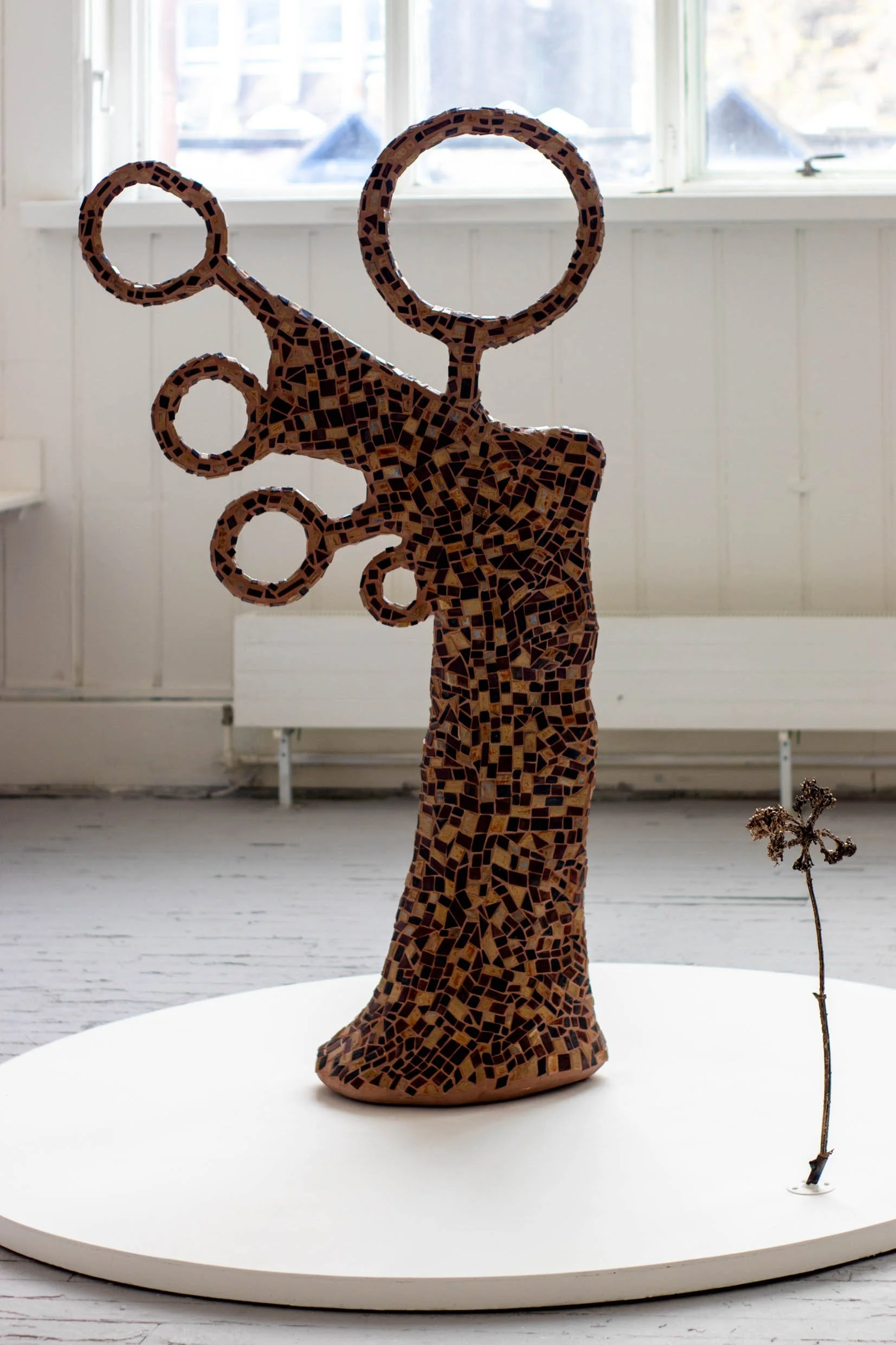 mosaic with handmade ceramic tesserae (157 × 88 × 32 cm), bronze hogweed sculpture (60 × 16 cm)