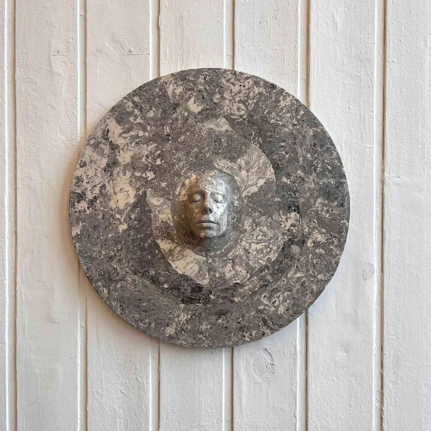 plaster and pigment wall sculpture (80 × 20 cm)