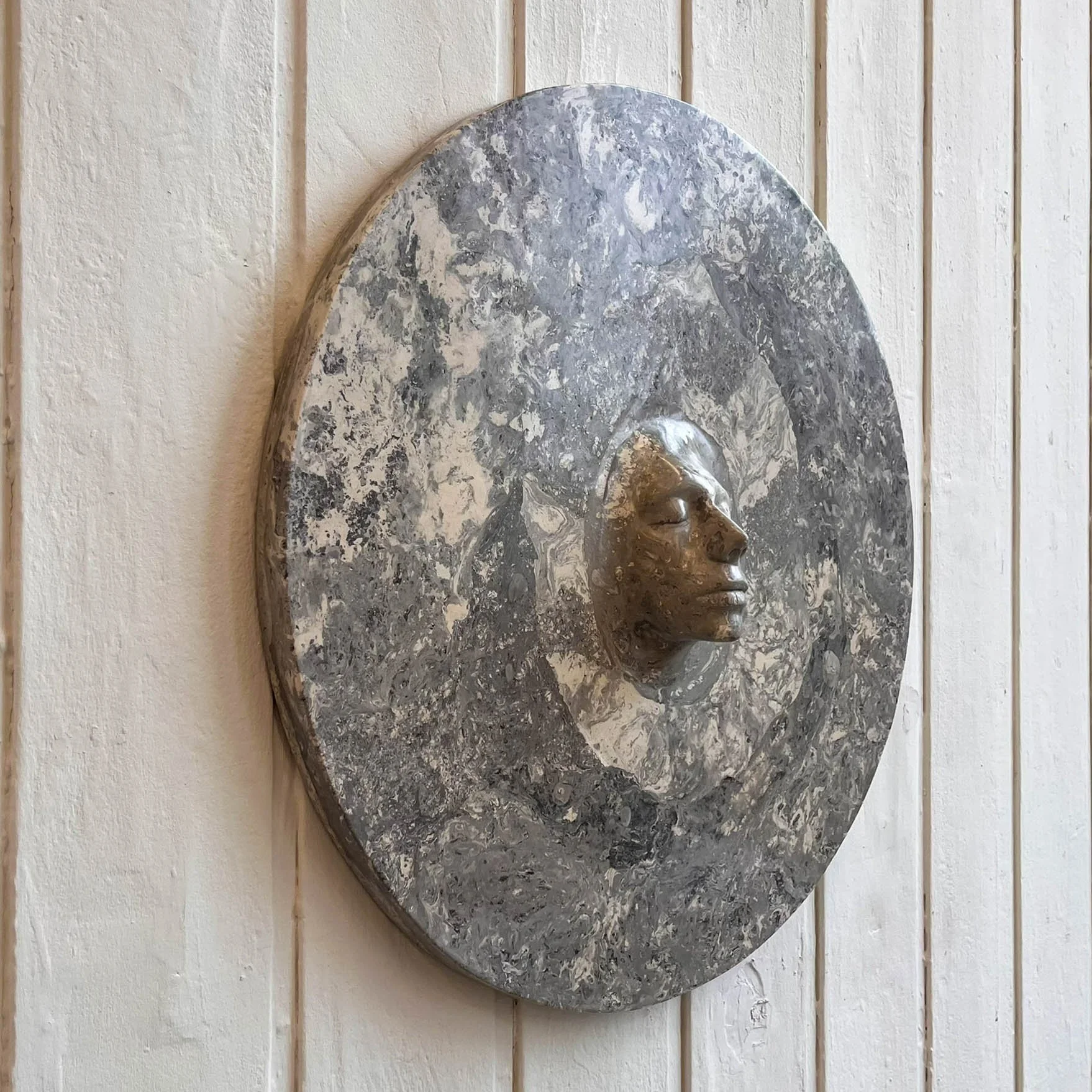 plaster and pigment wall sculpture (80 × 20 cm)