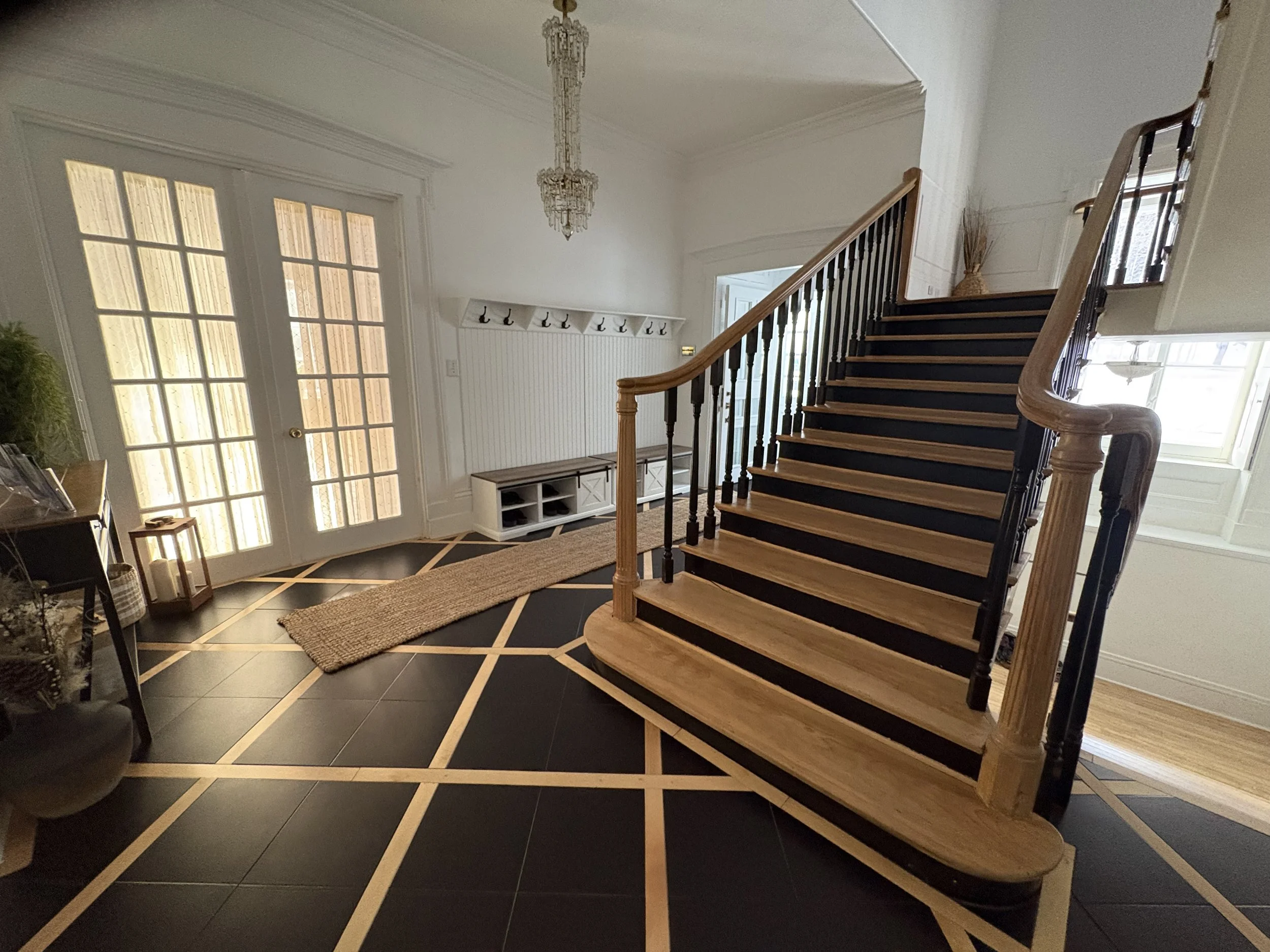 House entryway for guests with staircase