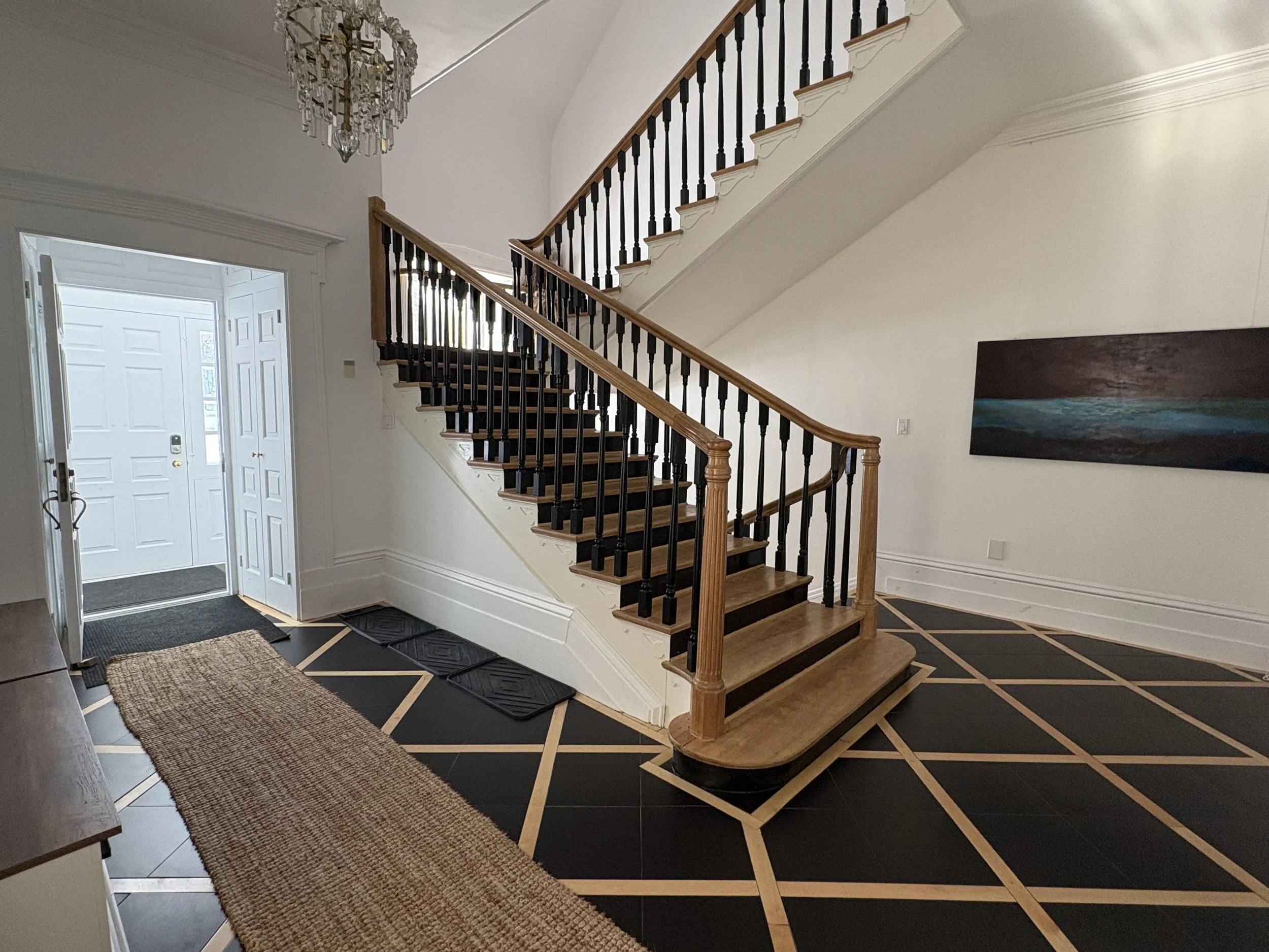 Entryway of the manor, with staircase to the upper level apartment