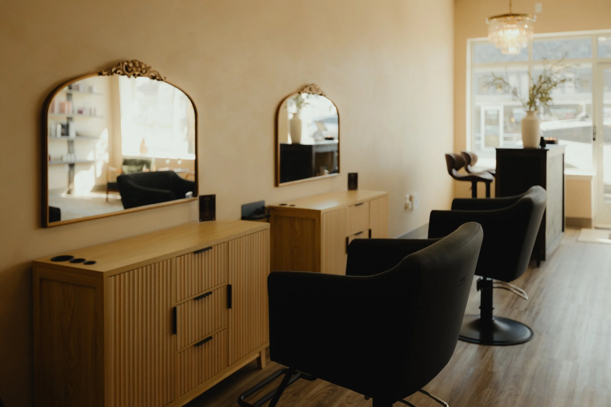 Hair styling stations at Nova Salon & Head Spa in Columbus, Ohio, with two salon chairs, mirrors