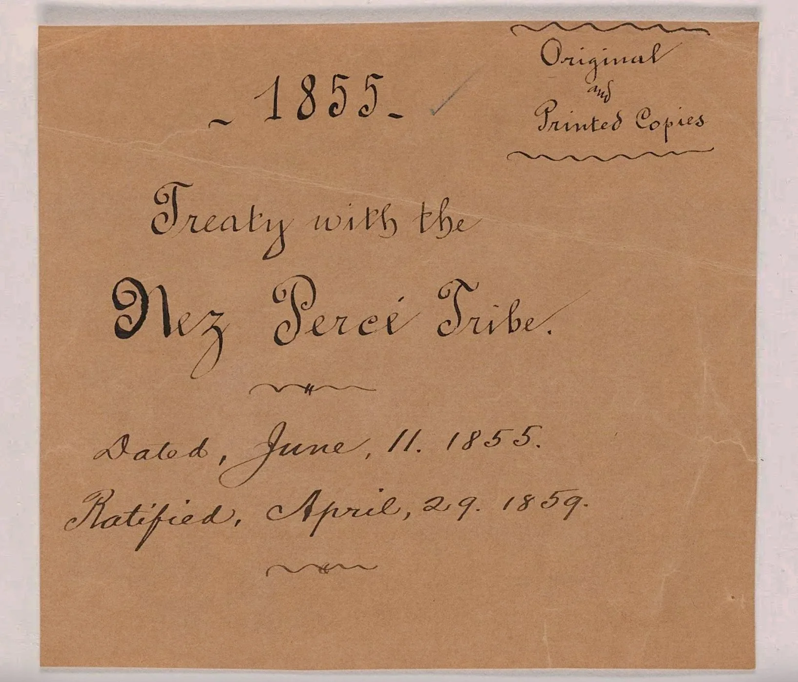 Photograph of a handwritten document dated June 11, 1855, with elegant cursive script on light brown paper discussing original and printed copies, with additional notes from April 29, 1859.