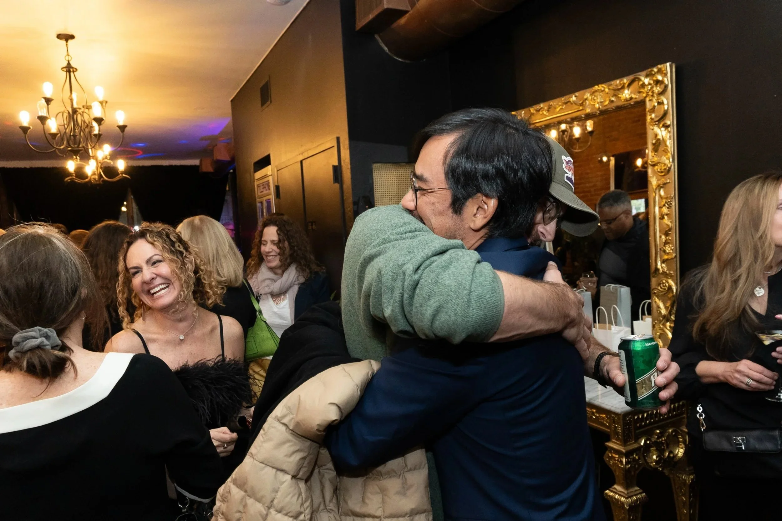 Guest greeting each other with a hug at a birthday party