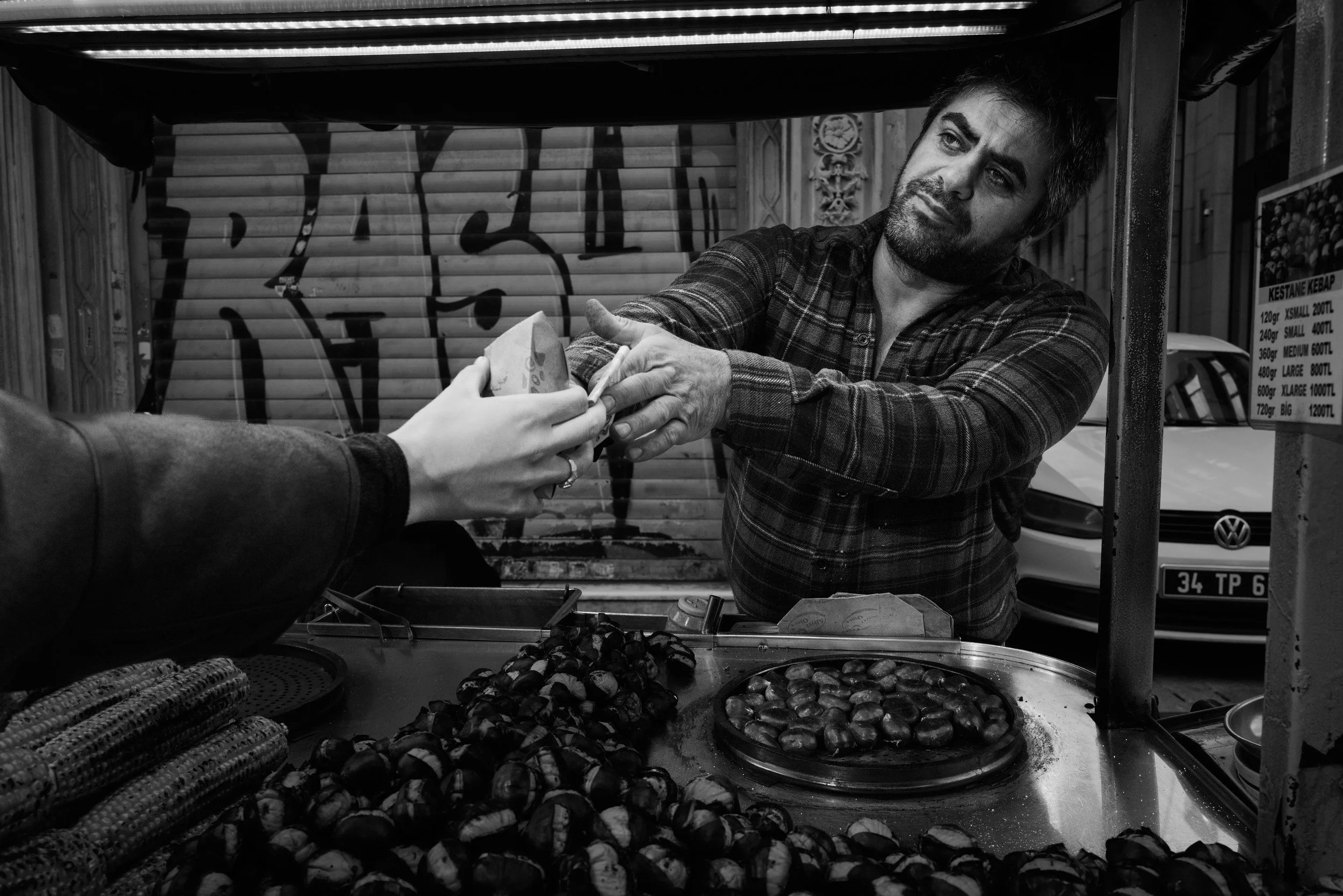 A vendor serving food from his stall
