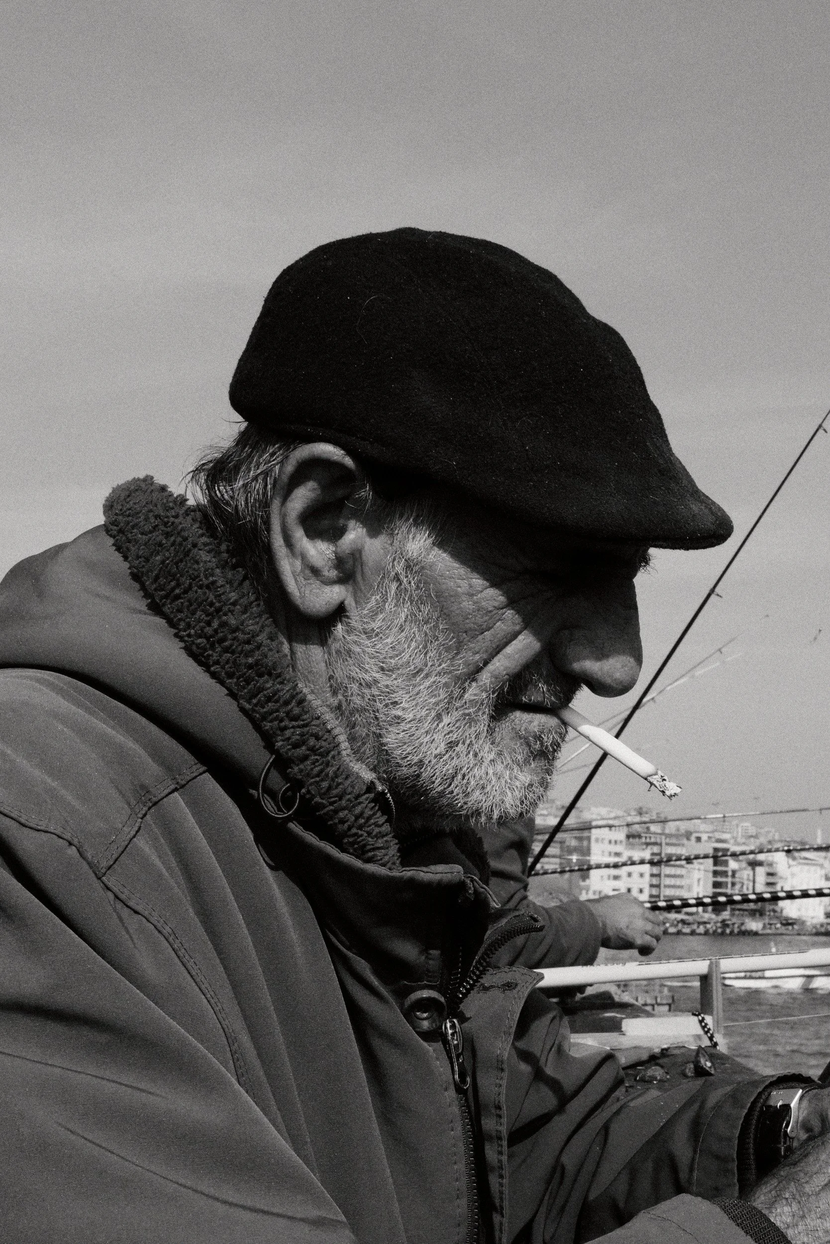 A fisherman concentrating on his line