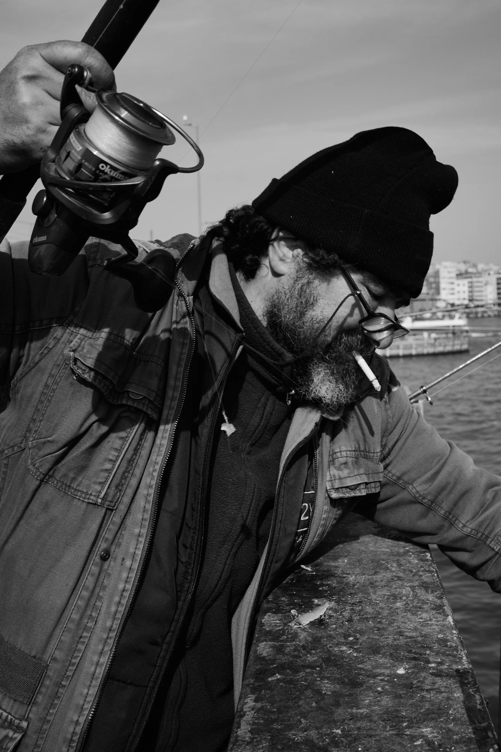 A fisherman raising his rod
