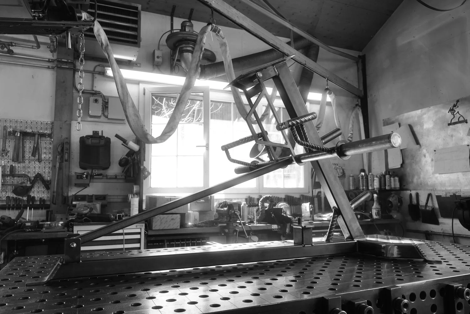 Gym equipment construction on a workshop bench