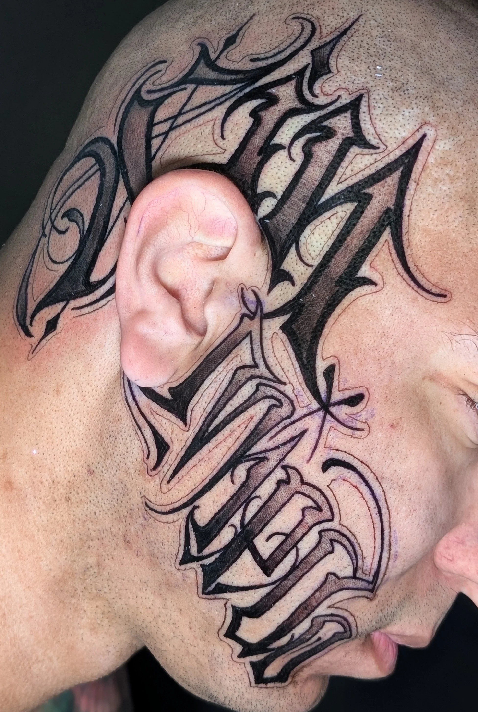 Lettering on Head Tattoo