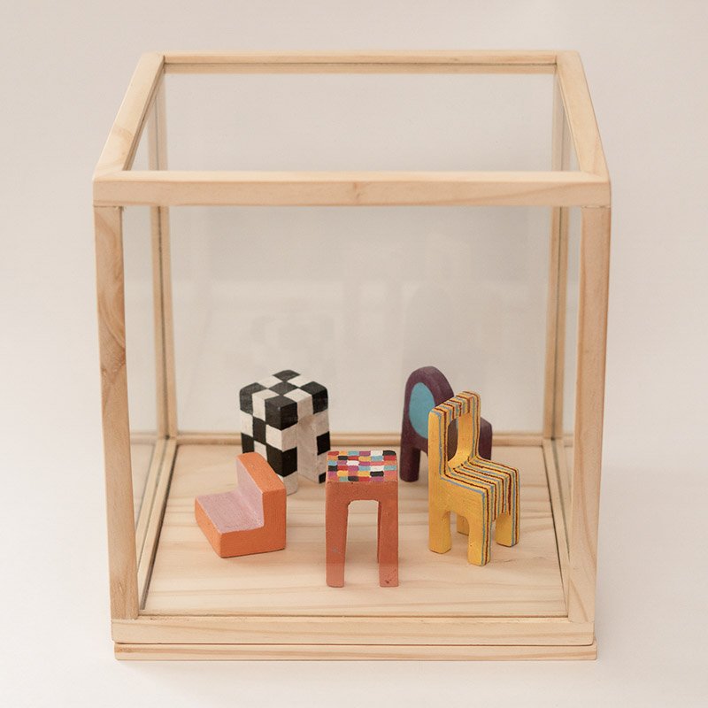 Circle-of-colored-chairs-carved-in-wood-2.jpg