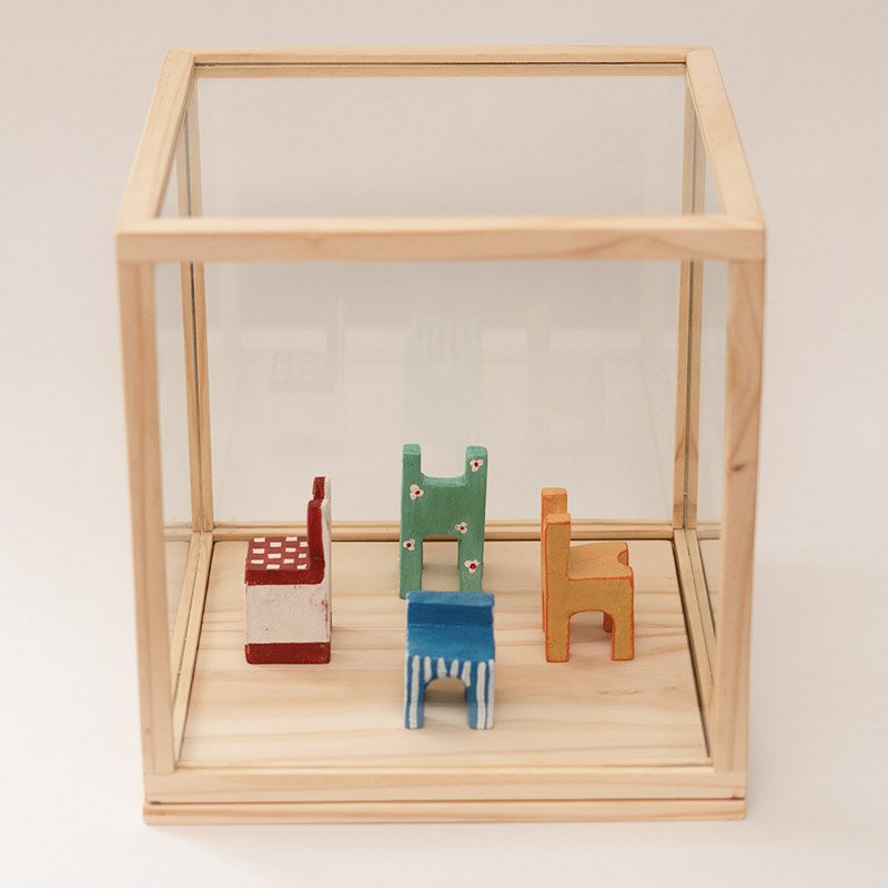 four-colored-chairs-carved-in-wood.jpg