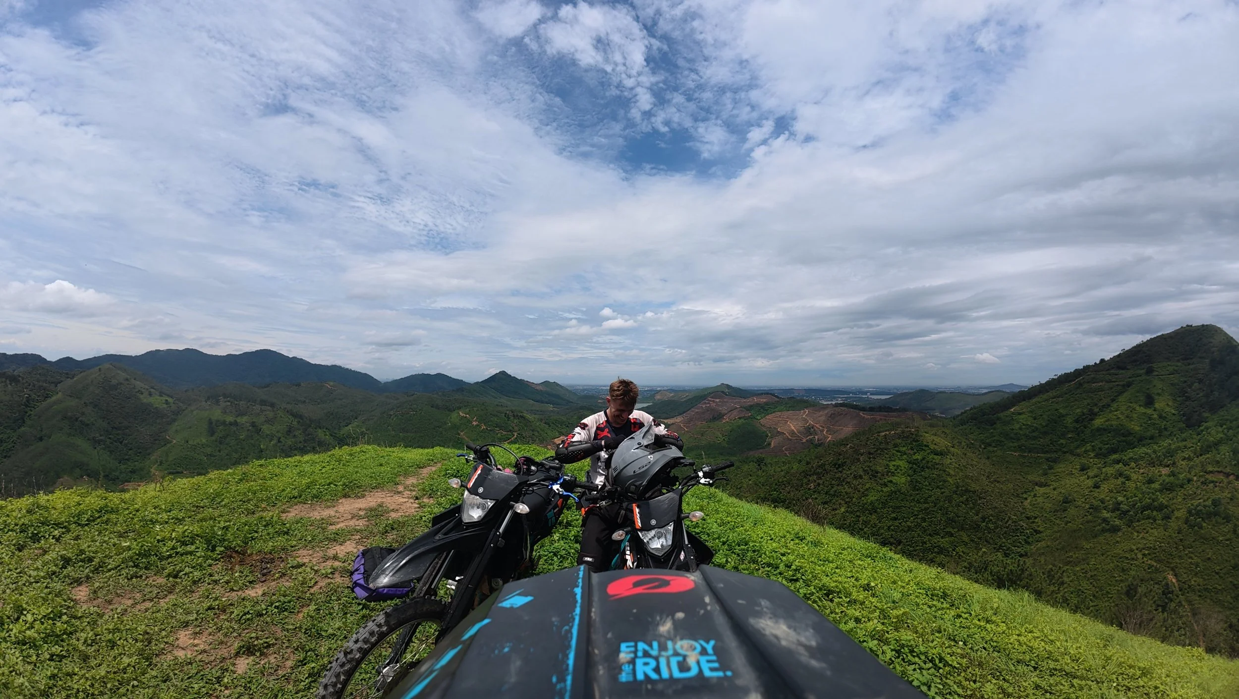 Two bikes at the top of a mountain on a one day off-road tour