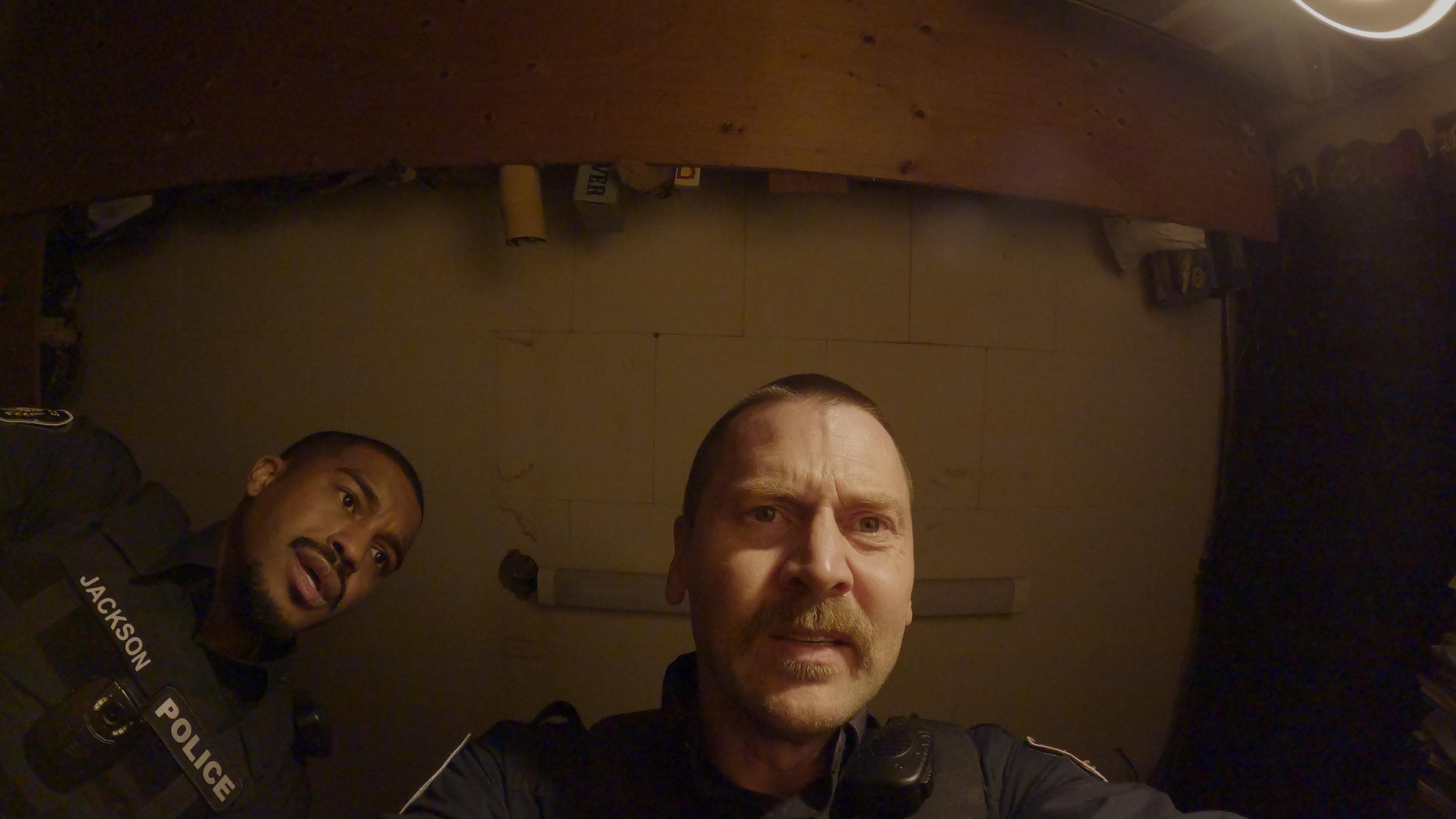 Bryce and Jackson looking down at Bryce's bodycam