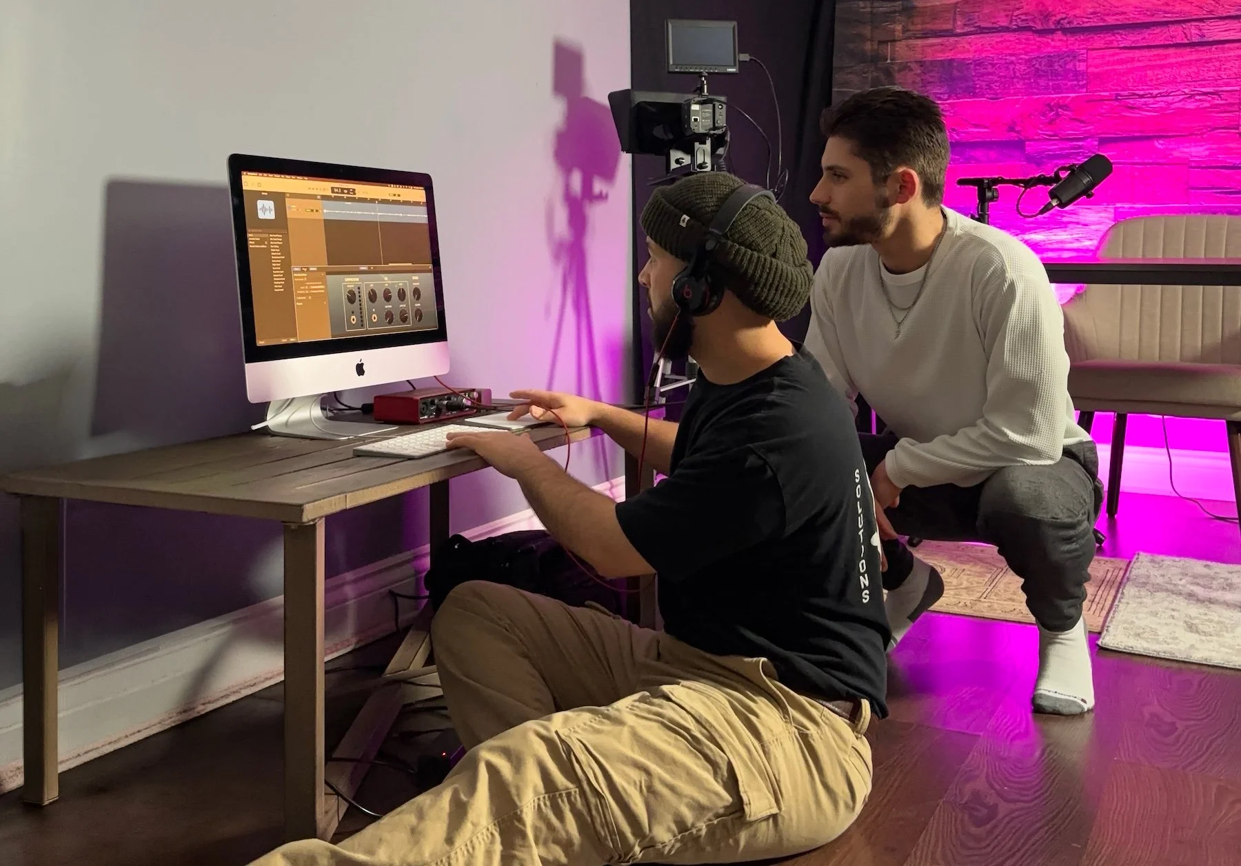 Hyve Agency team reviewing and editing B2B founder video content in the studio