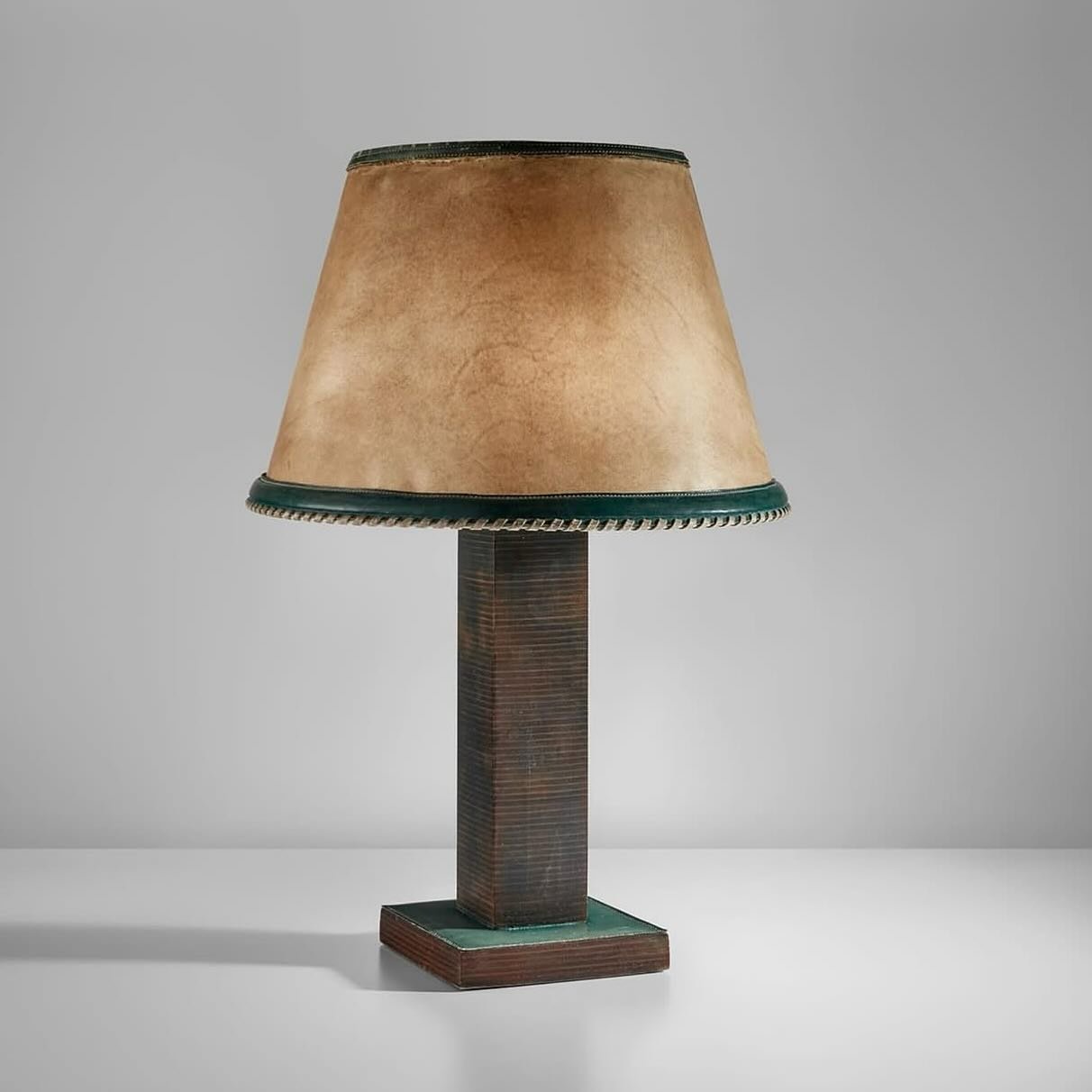 Paul Dupre - Lafon (1940s)
Table lamp Leather, parchment shade Via: @phillipsauction