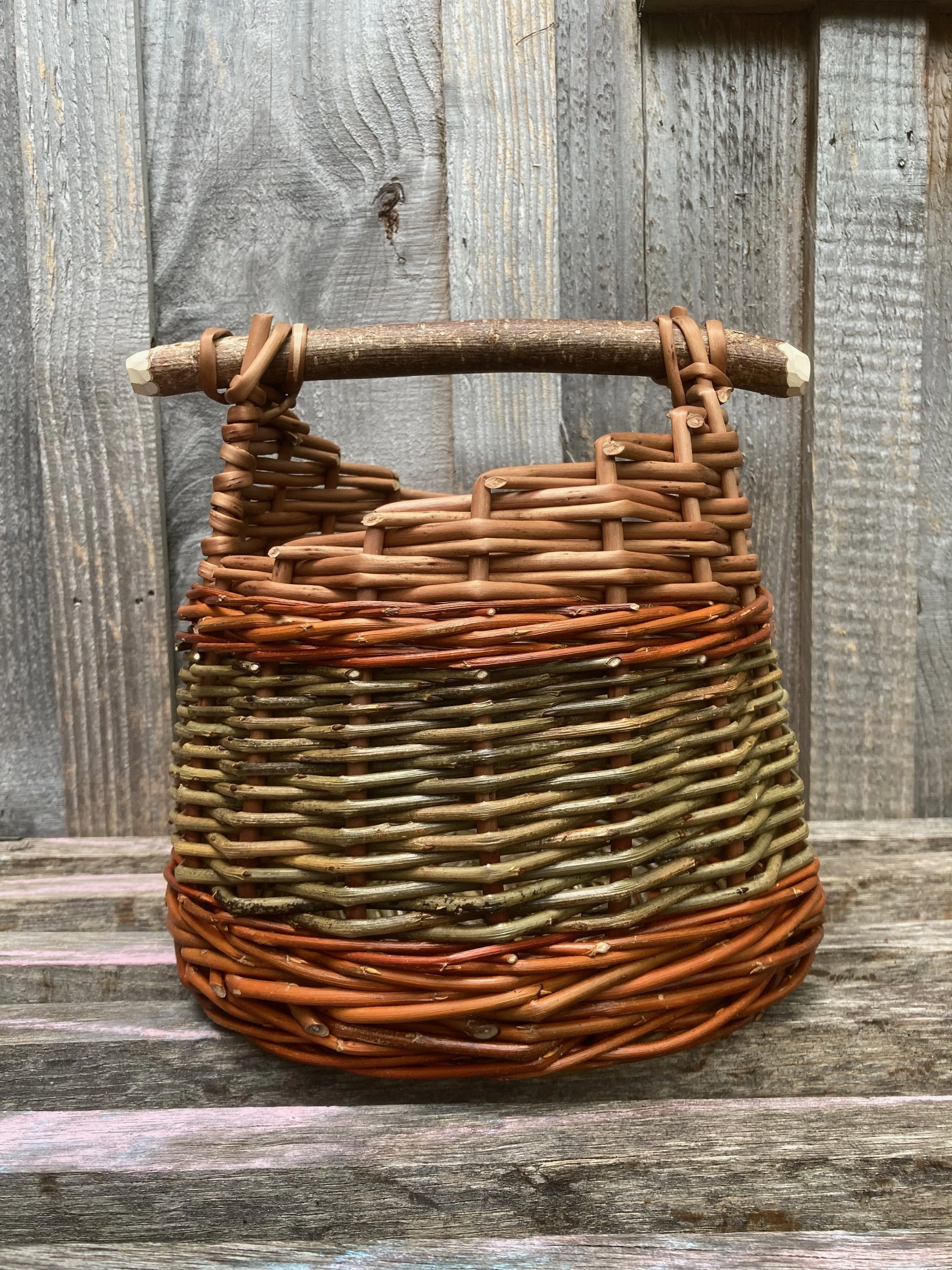 Asymmetric spiral topped basket