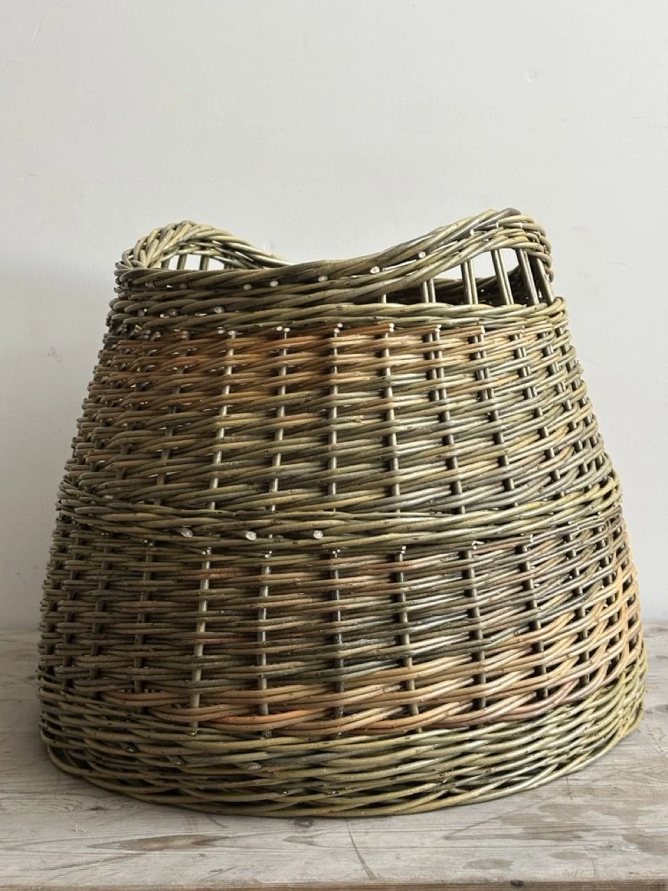 willow log basket with slot handles