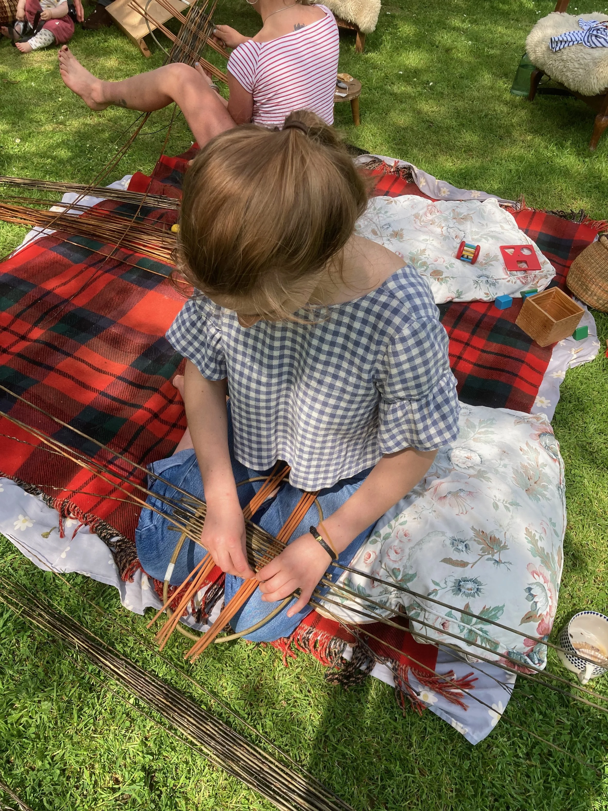 weaving outside making bags