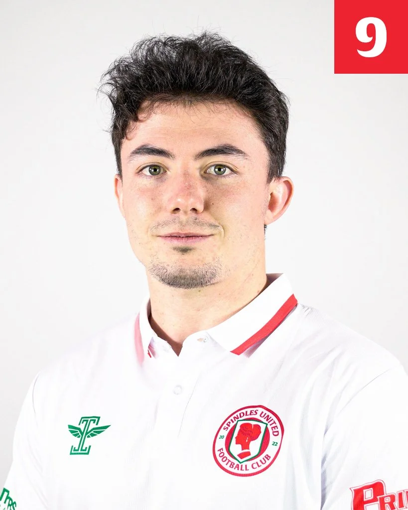 A man with dark wavy hair, wearing a white sports shirt with the Fulindes United Football Club logo. The number 9 is in the top right corner.