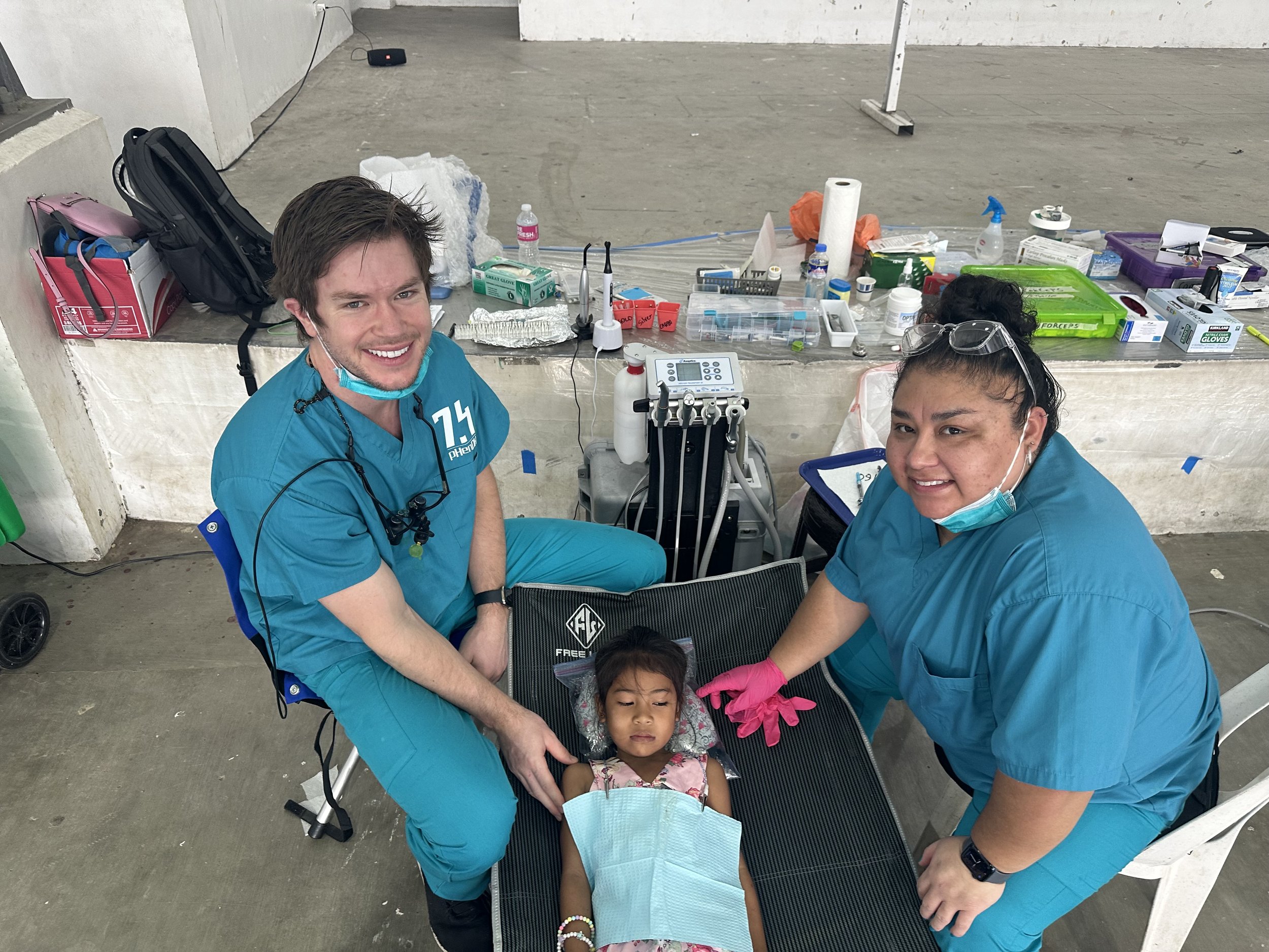 Philippines 2024 Marisol and Alex with young patient.jpeg