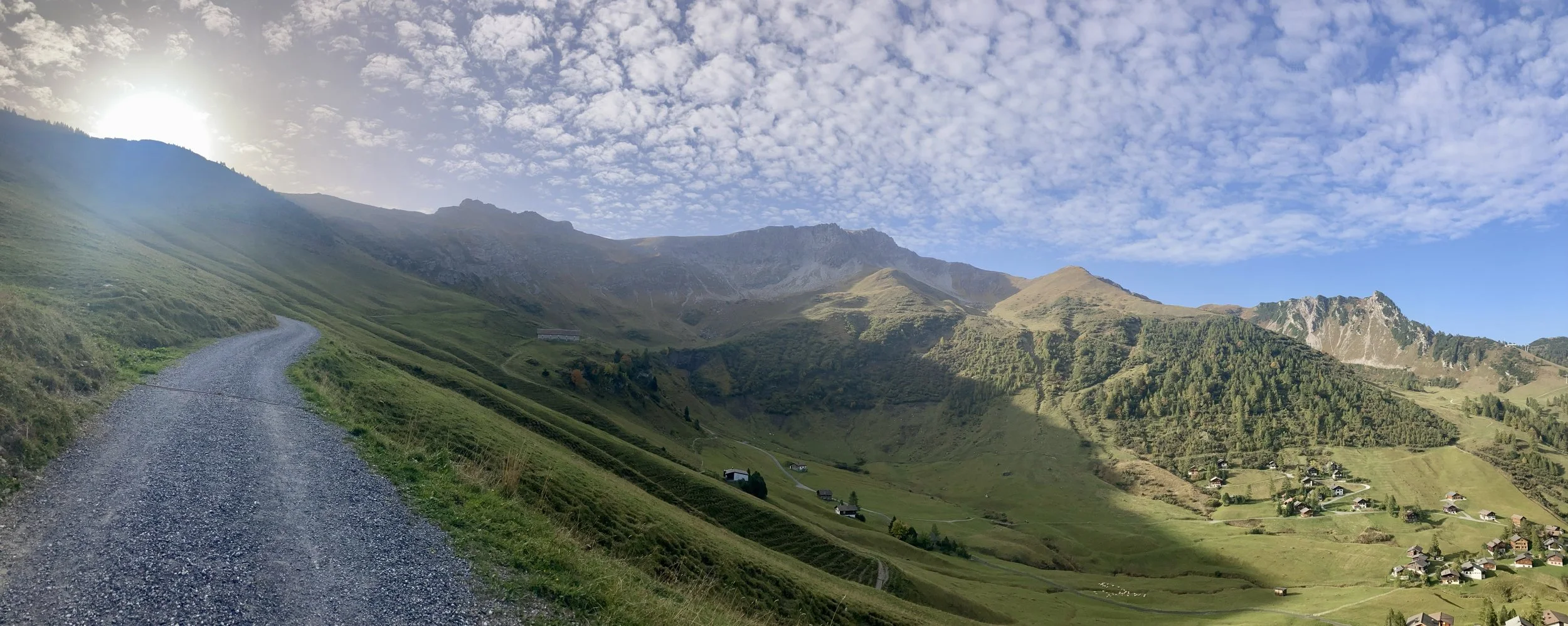 Image of valley village in Liechtenstein with sun setting behind the mountain