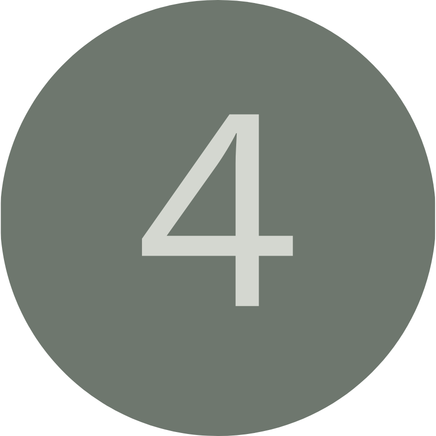 A gray circular sign with the number four in the center.
